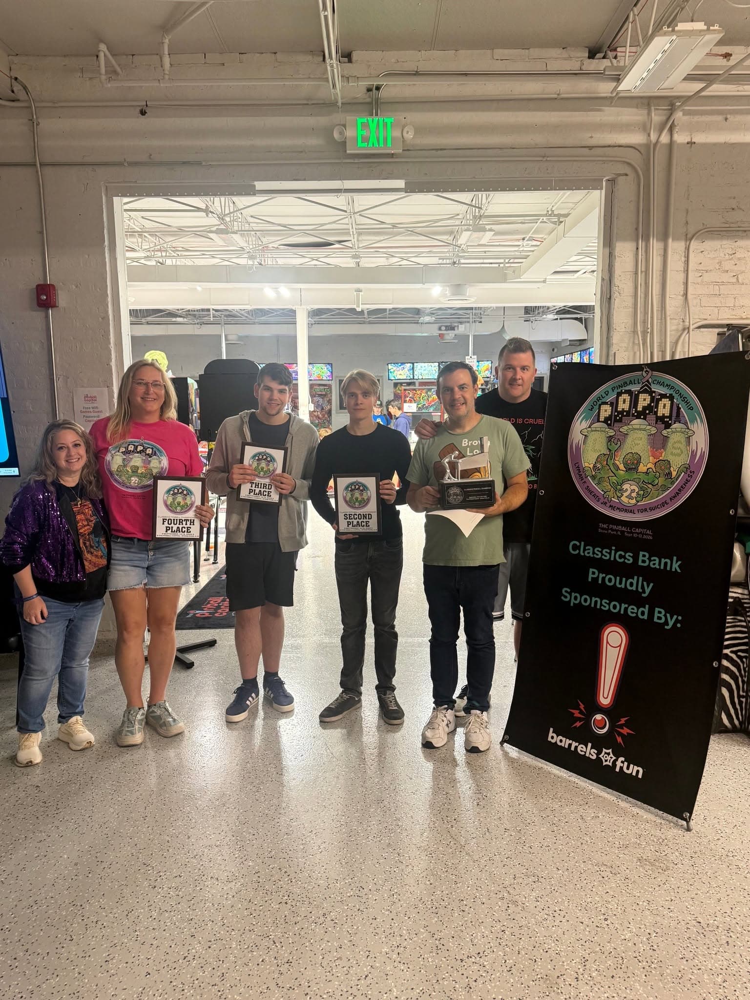 The PAPA 2026 Classics finalists with their plaques and trophy beside a Classics bank sponsor banner