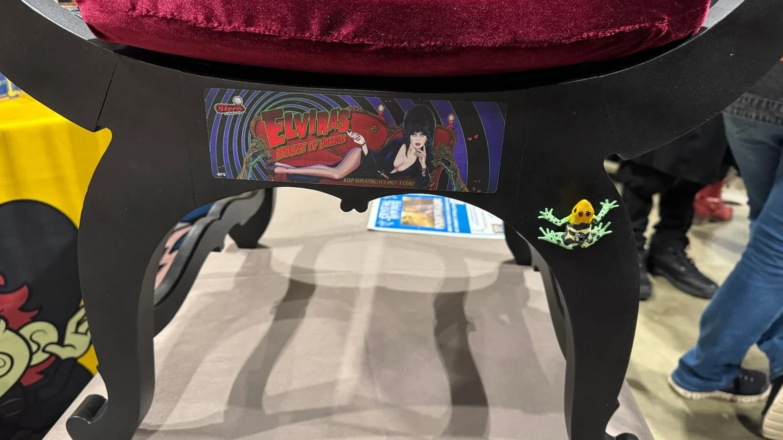 The base of the Elvira chair, with Elvira artwork on its front rail