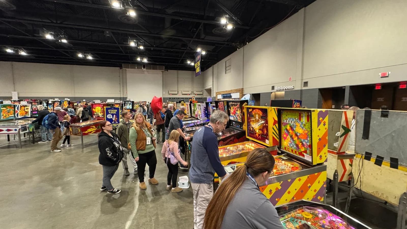 The Pinball Expo 2026 show floor, with rows of pinball machines and attendees