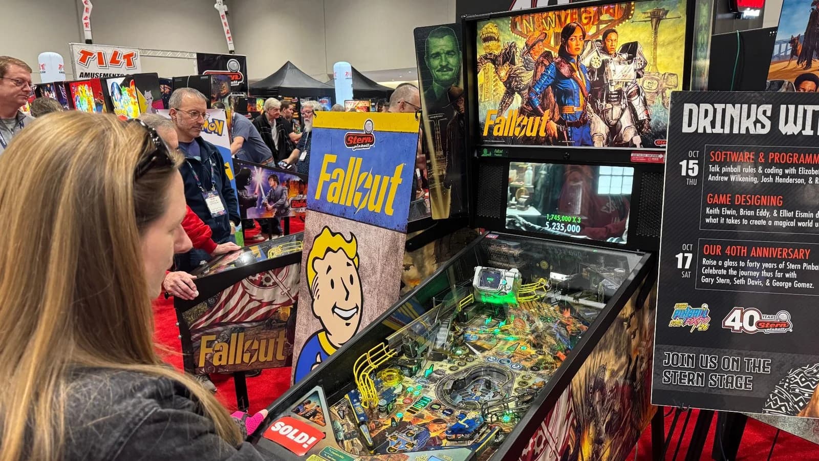 A player at Stern's Fallout, next to a sign listing Stern's seminars
