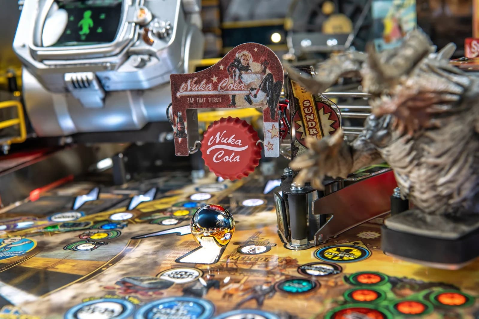 The Nuka-Cola bottle cap target on the Pro, Deathclaw behind it
