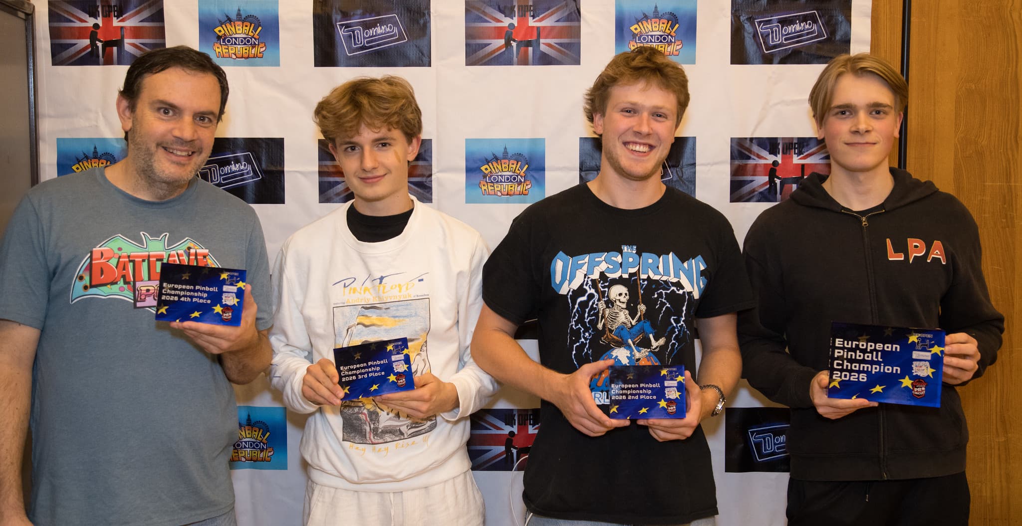 The EPC 2026 top four holding their awards, with Viggo Löwgren on the right holding the European Pinball Champion 2026 plaque