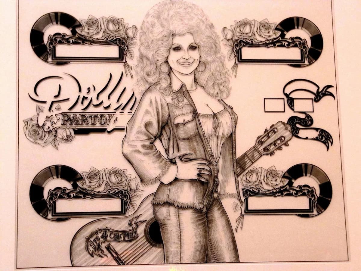 Dave Christensen's original Dolly Parton backglass drawing in black line art: Parton in a denim jacket and cut-off shorts with a guitar behind her, roses and records framing each of the four score windows, and 