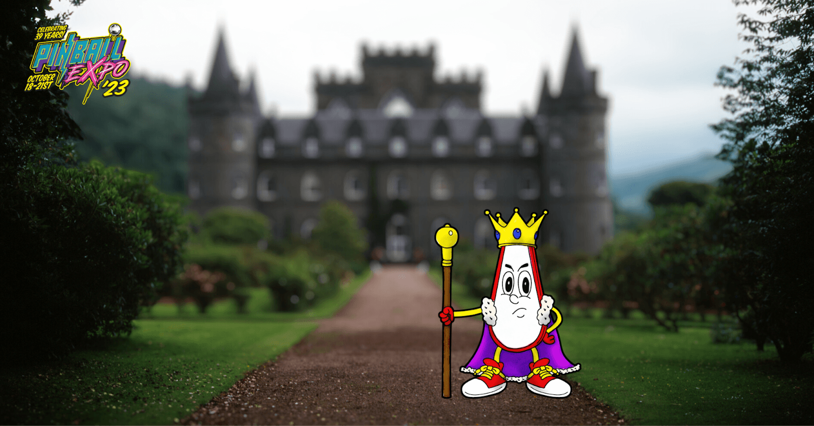 Cartoon pinball mascot standing on path with medieval castle in background