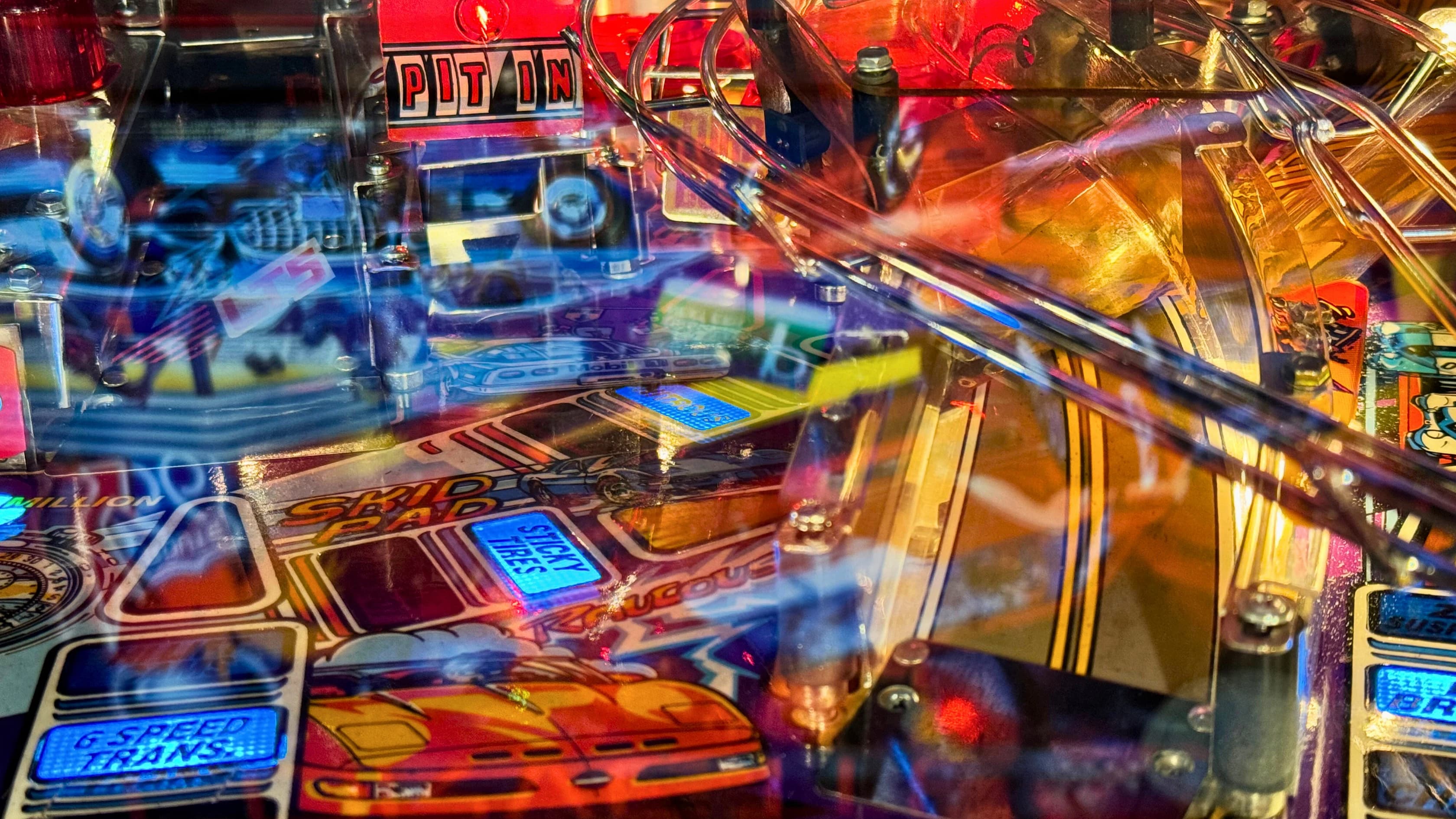 Colorful pinball machine with vibrant lights and intricate mechanical details