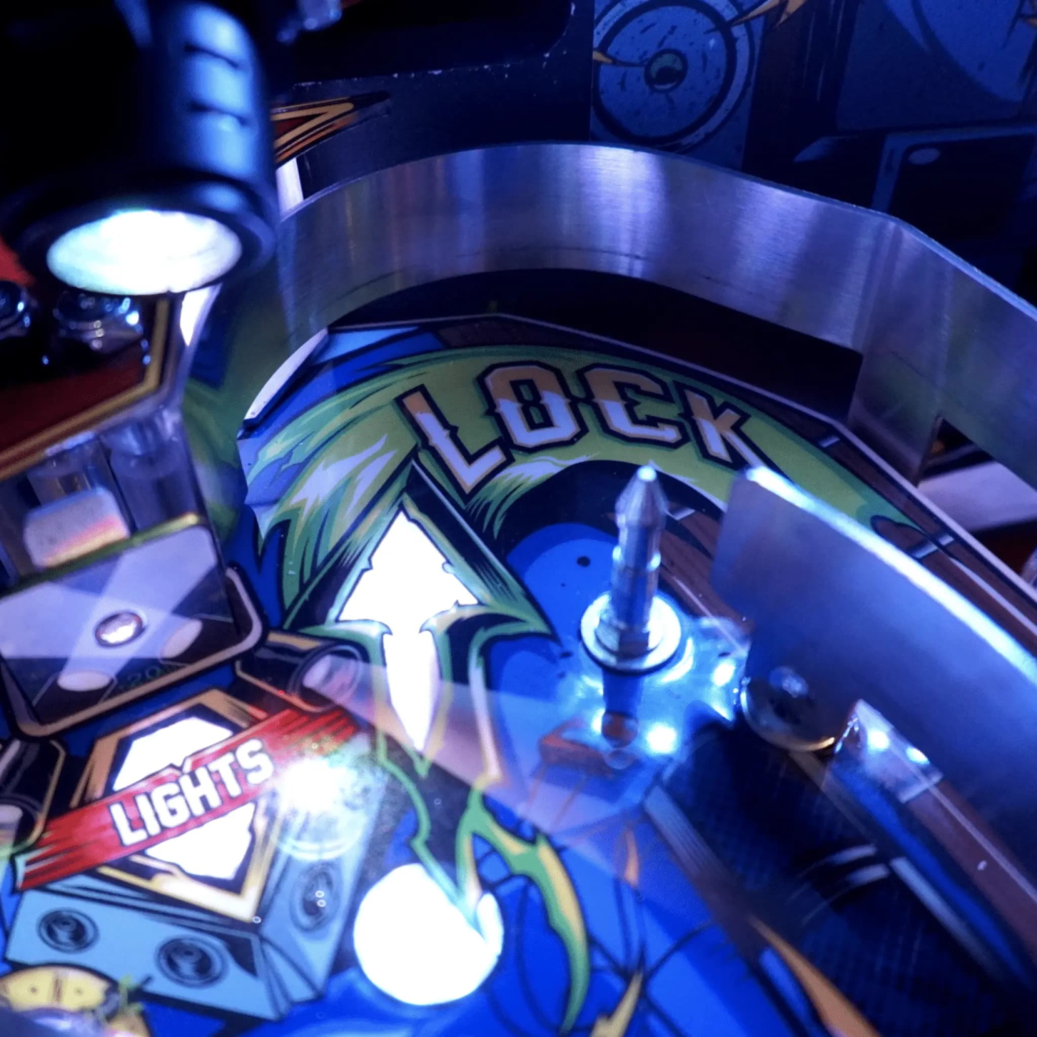 Pinball machine detail with Lock and Lights display in blue tones