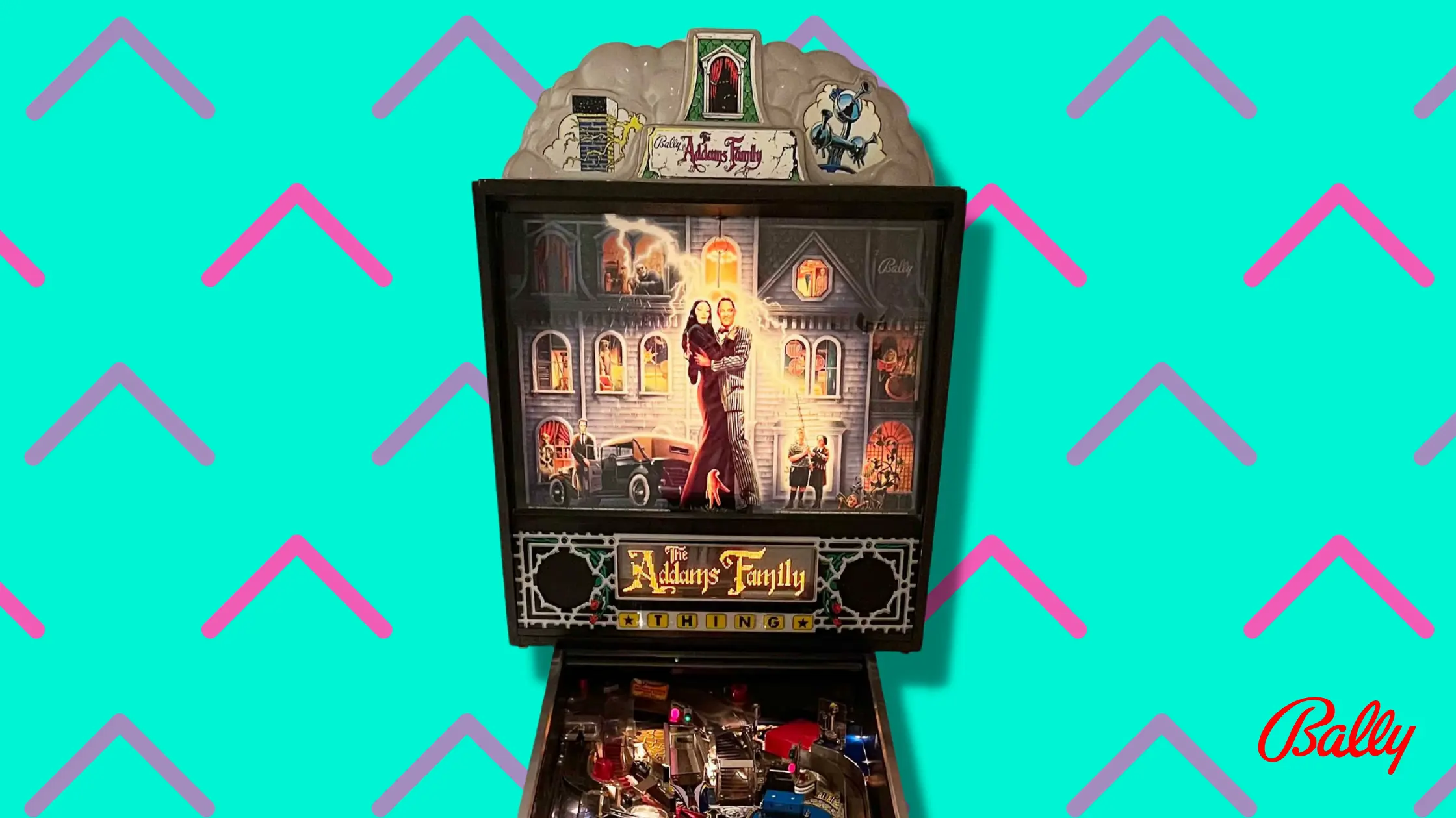 Addams Family pinball machine with gothic-style artwork on colorful background