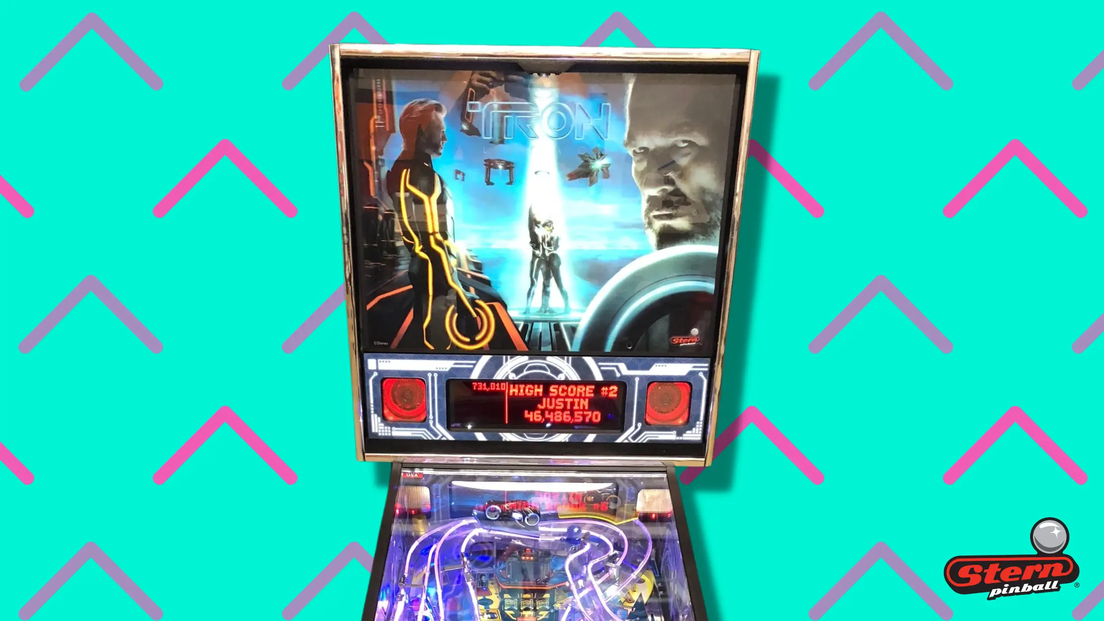 Tron Legacy pinball machine with colorful playfield and high score screen