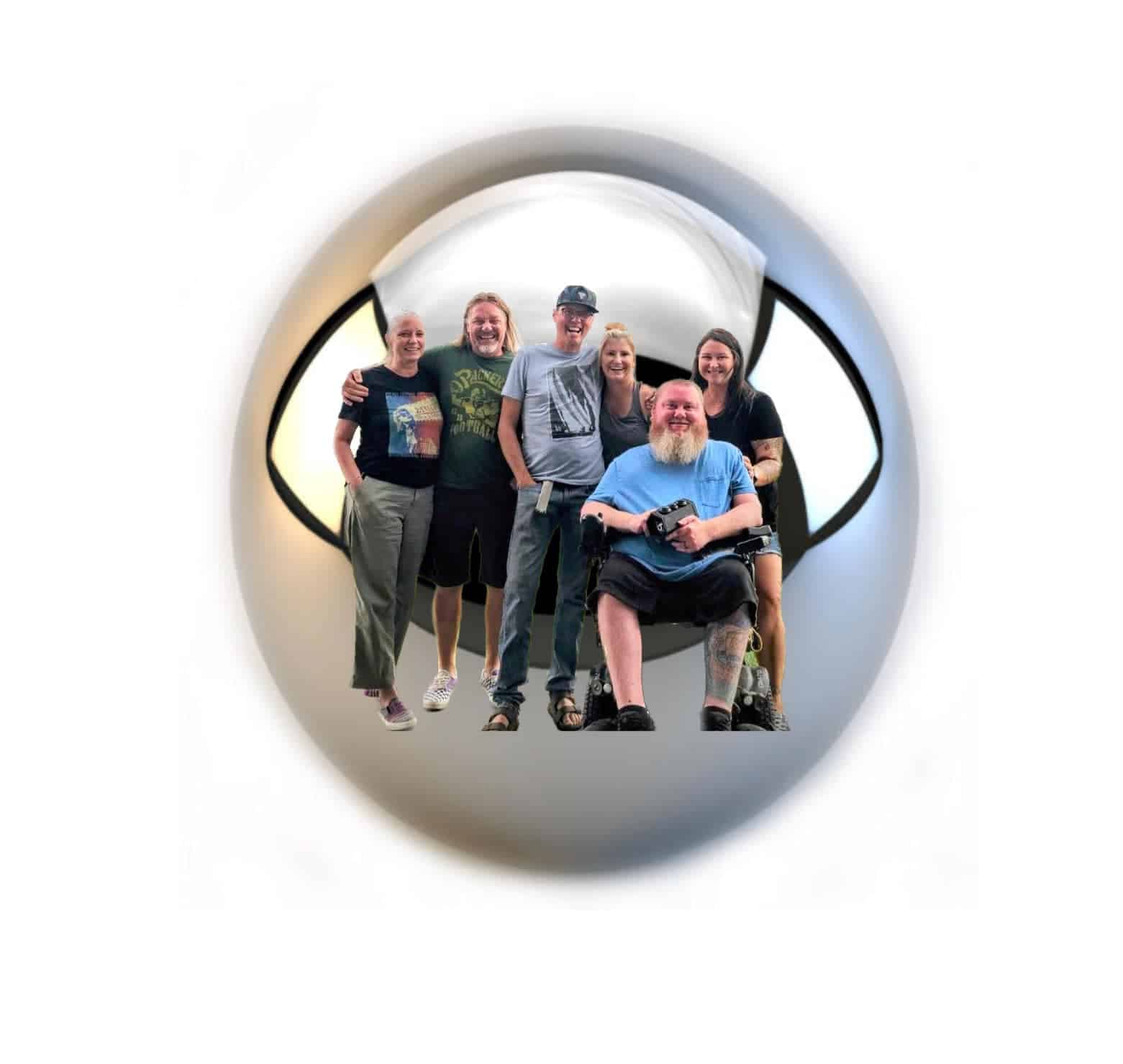 Group photo of six people viewed through a circular fisheye lens