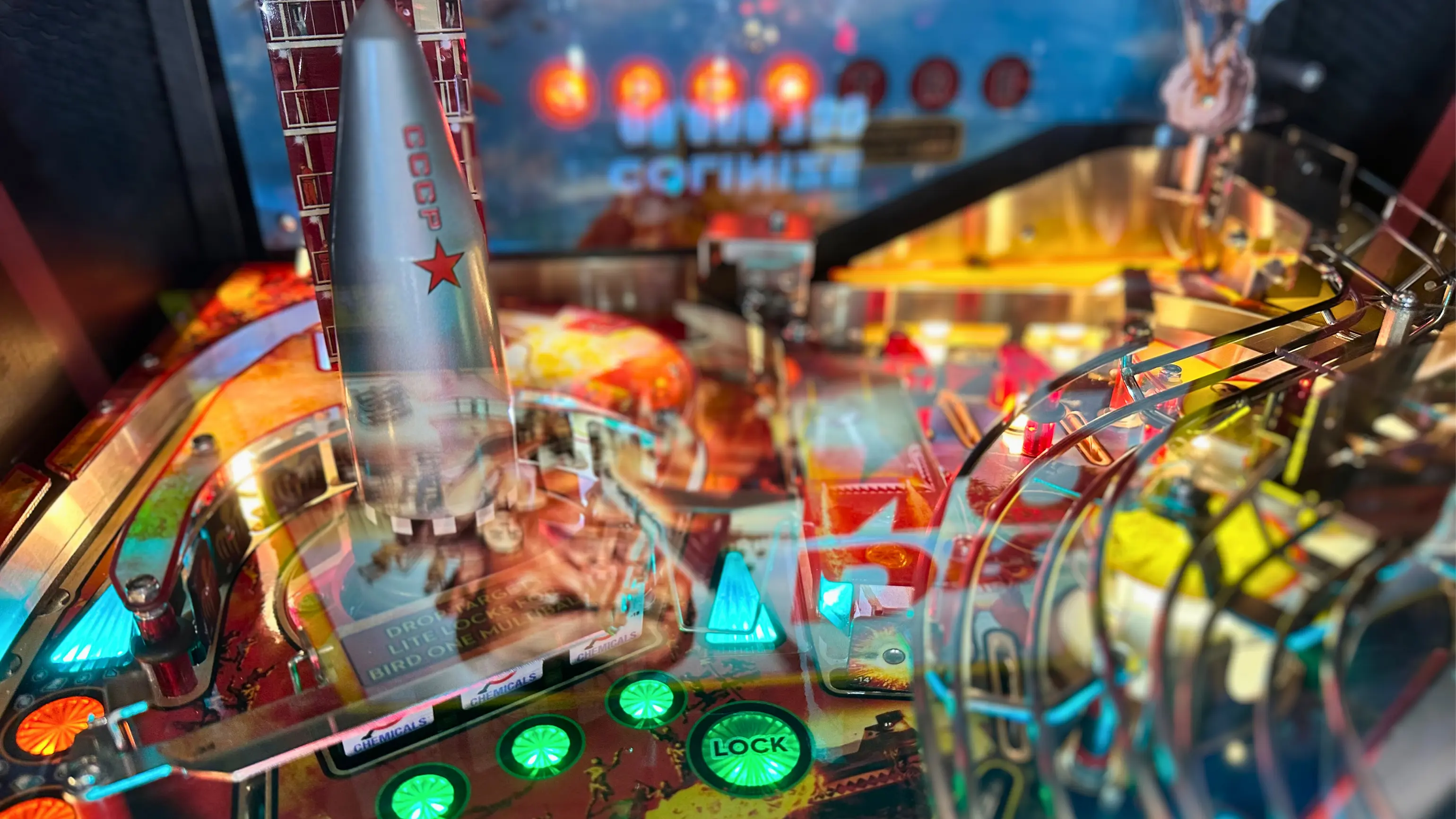 Colorful retro pinball machine with CCCP rocket and glowing buttons