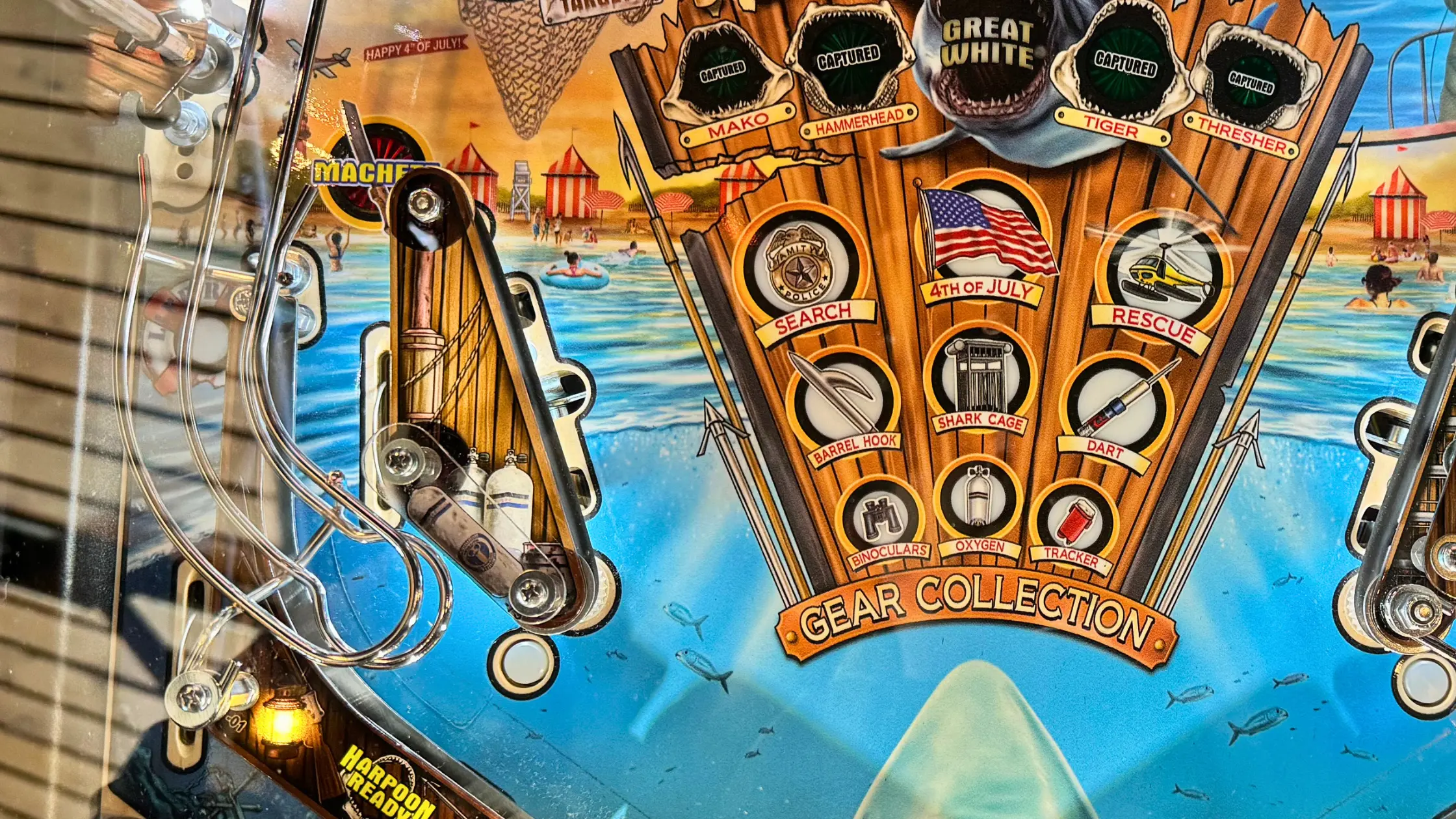 Shark-themed pinball machine with 4th of July beach rescue gear collection