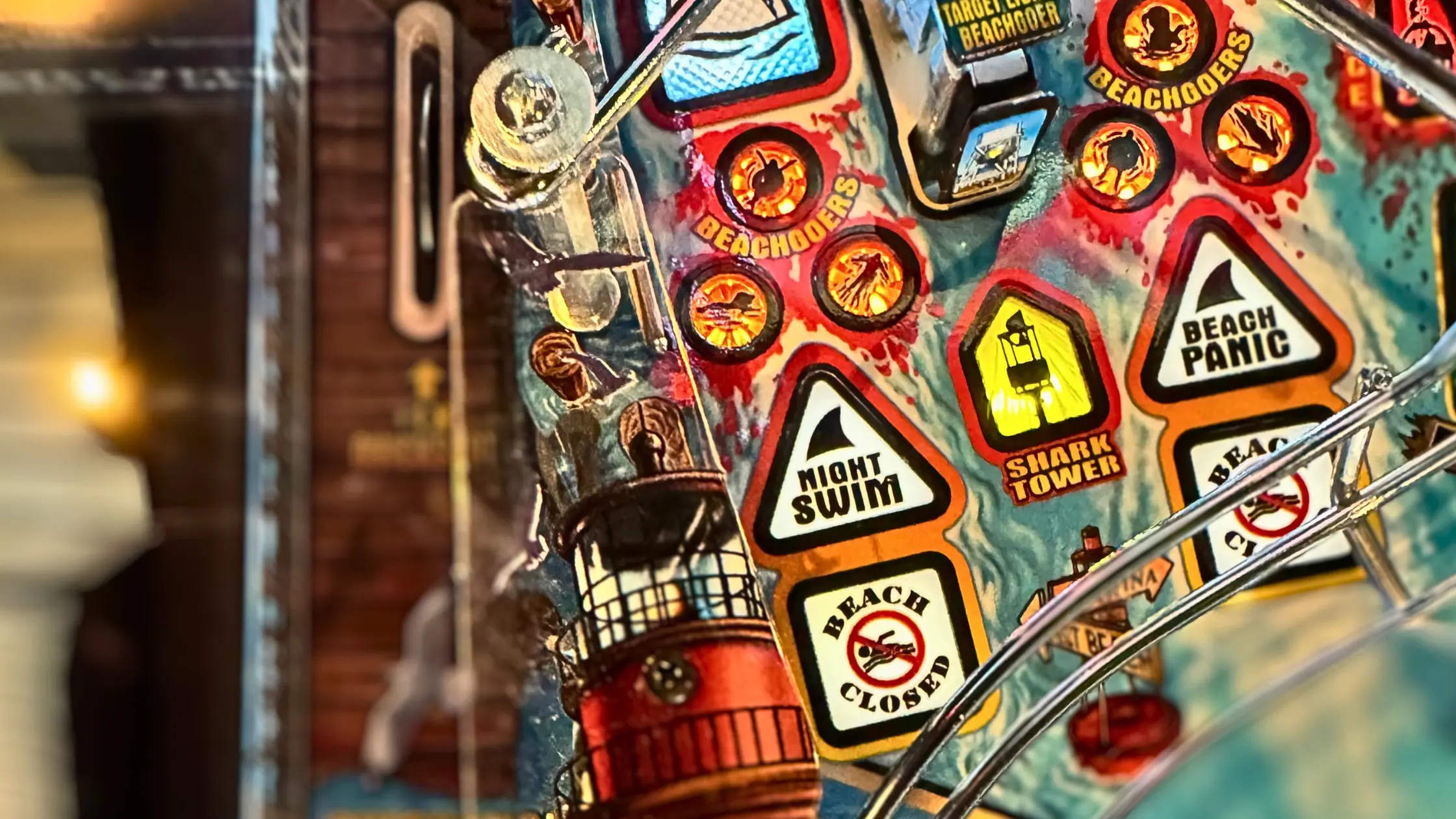 Colorful beach warning stickers and signs with lighthouse and shark icons