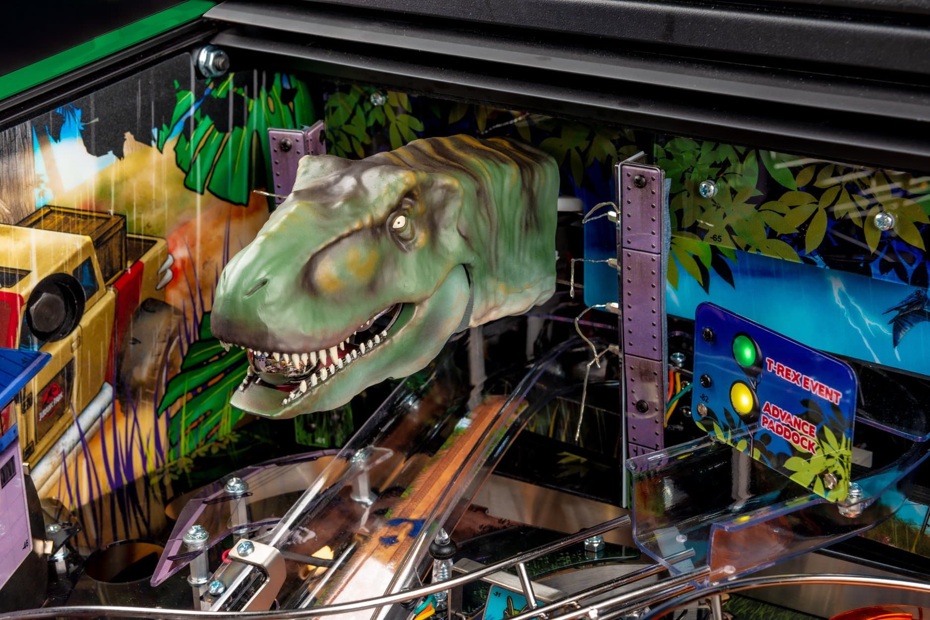 Detailed T-Rex head on a colorful pinball machine with jungle background