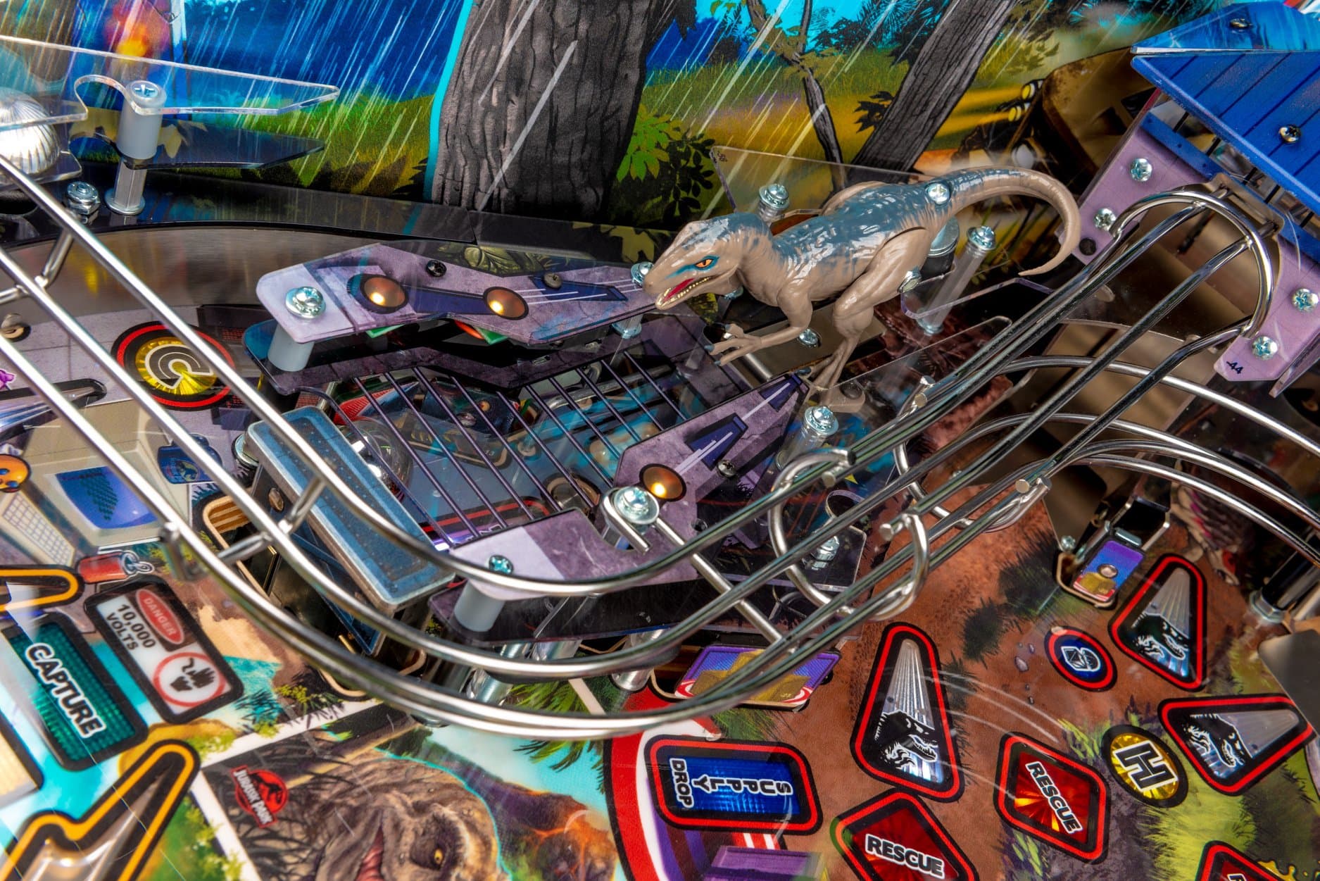 Jurassic Park pinball machine with intricate dinosaur and metallic track details