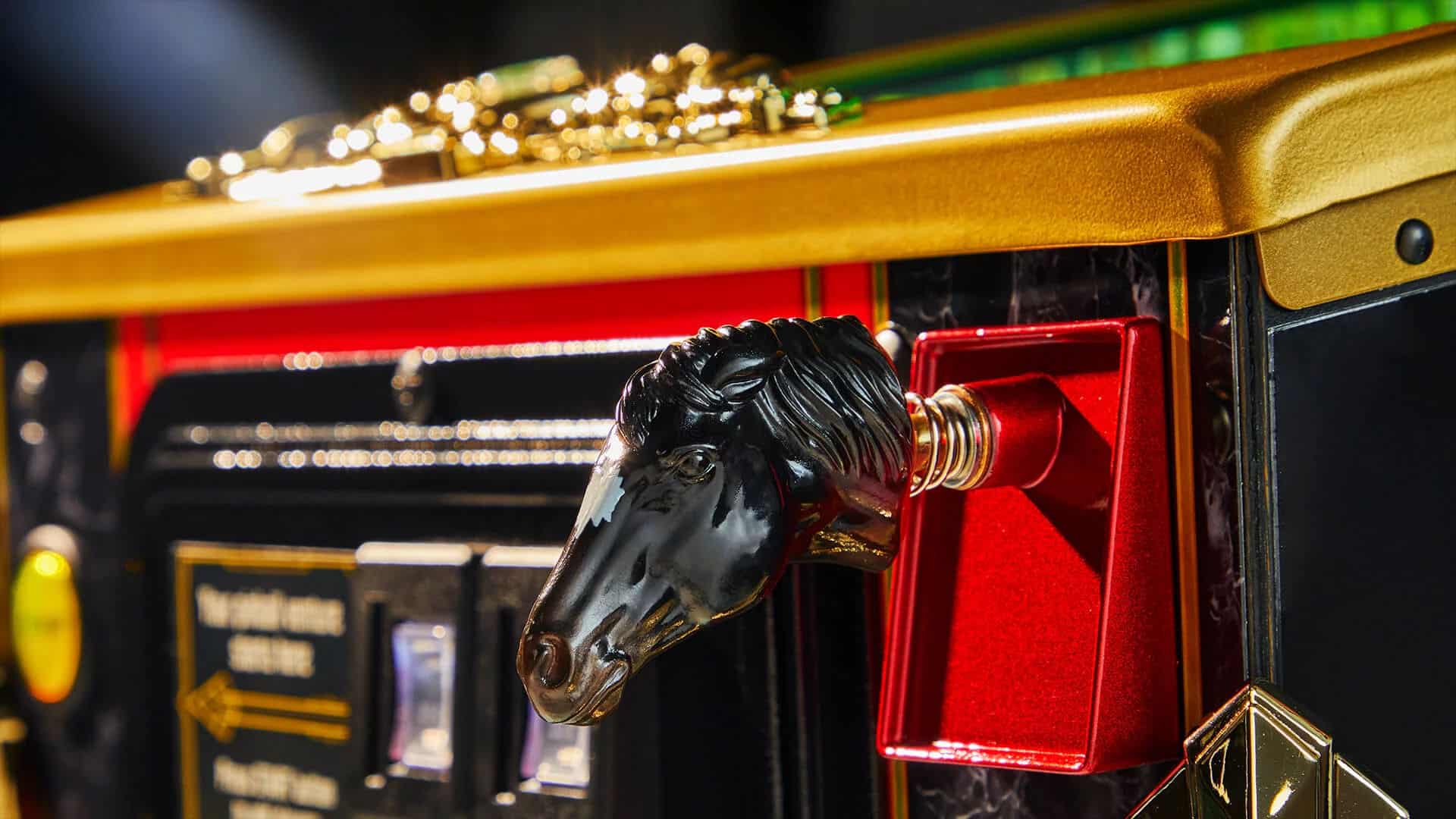 Black horse head statue on red and gold mechanical device