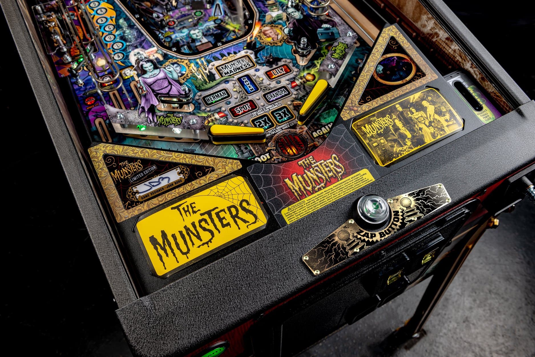 The Munsters themed pinball machine with colorful playfield and yellow logo