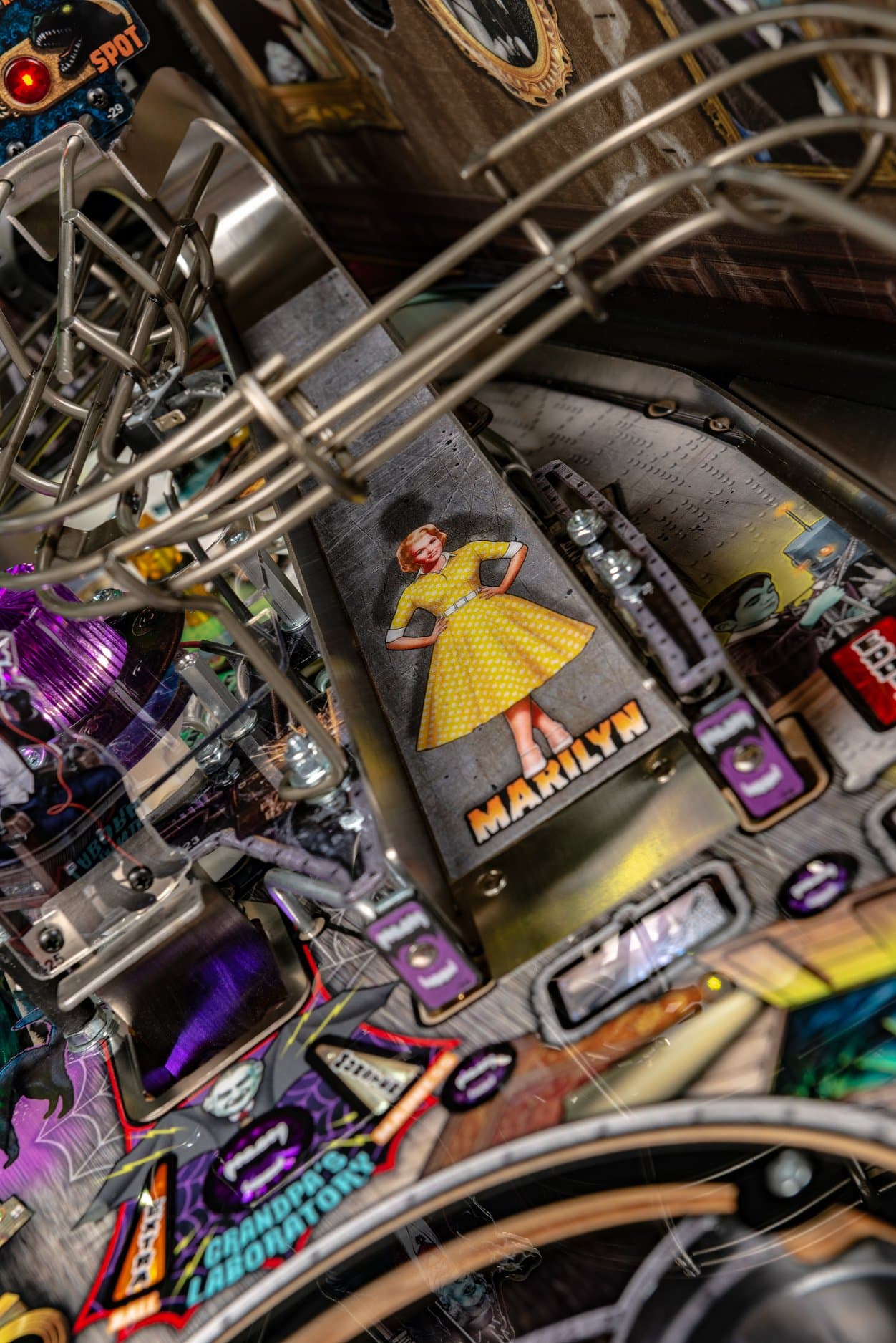 Vintage pinball machine detail with retro woman in yellow dress
