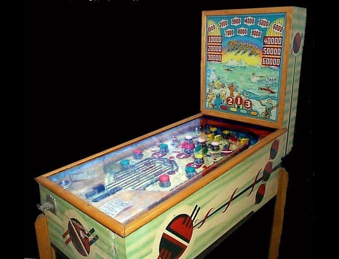 Nippy pinball machine photographed from the front, its backglass showing a seaside scene, Chicago Coin Machine Manufacturing Company, 1939