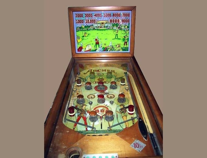 Archer pinball machine, its backglass showing archers at the targets, Genco Manufacturing Company, 1937