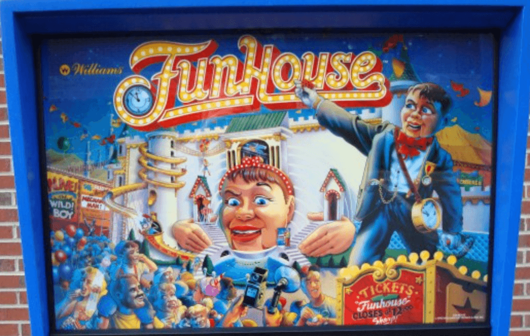 Funhouse pinball machine artwork with colorful carnival characters and attractions