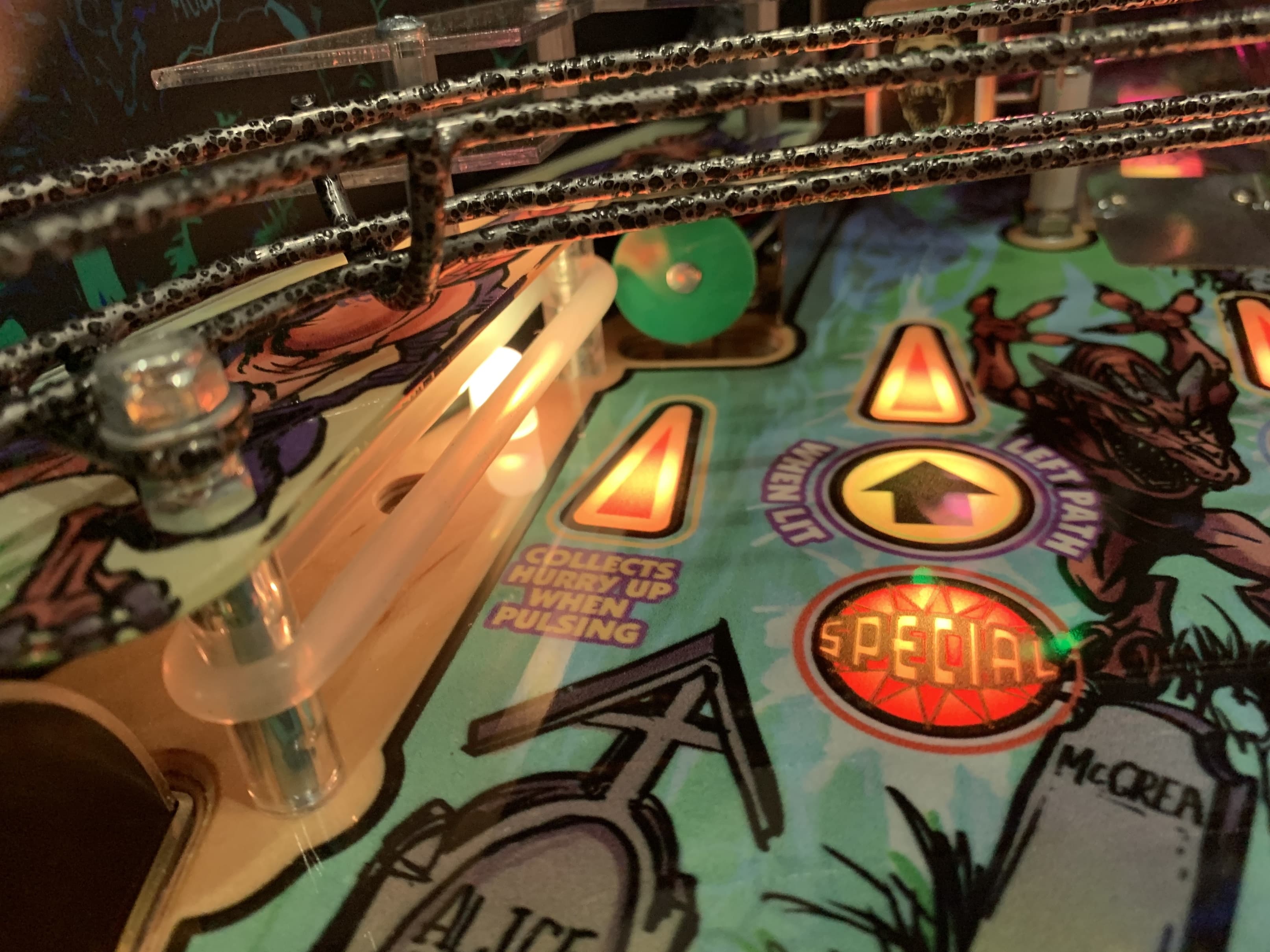 Colorful pinball machine with glowing lights and special game elements