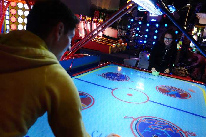 How do you play air hockey?