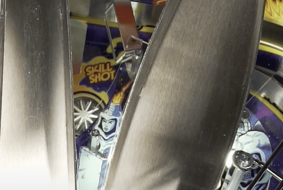 Skull Shot pinball machine artwork partially visible through metal panels