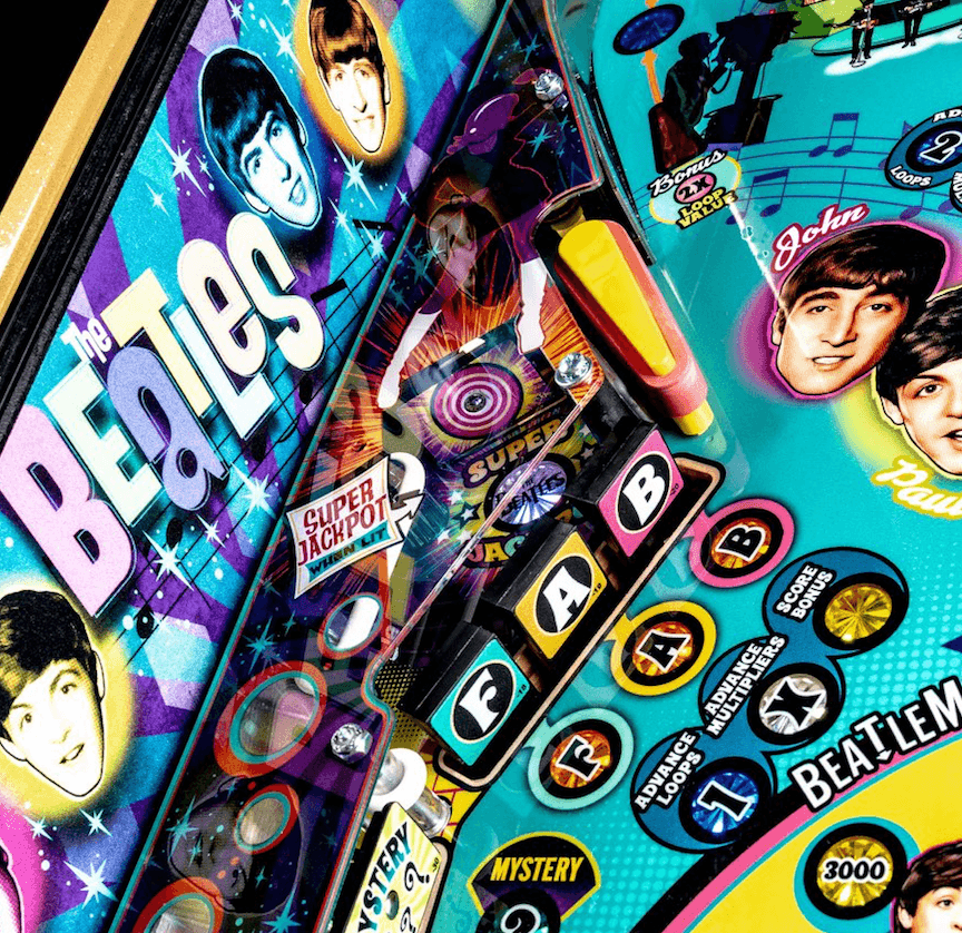 Colorful Beatles-themed pinball machine with band members and psychedelic design