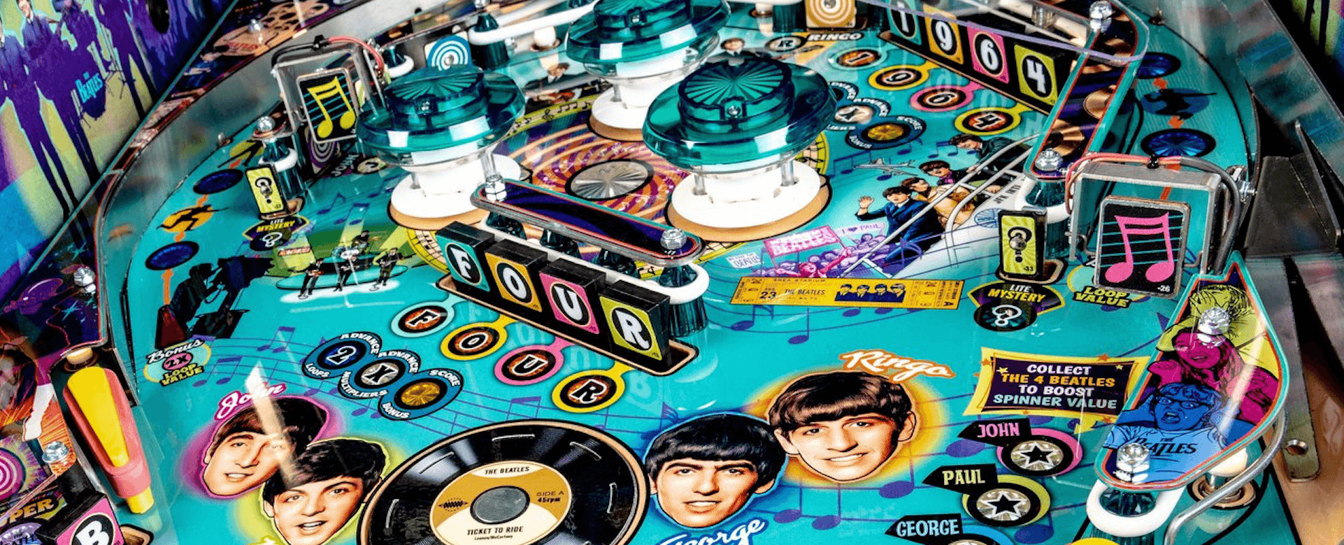 Beatles-themed pinball machine with colorful design and band members' images