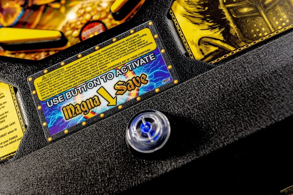 Magna Save button with electric blue label on textured black surface