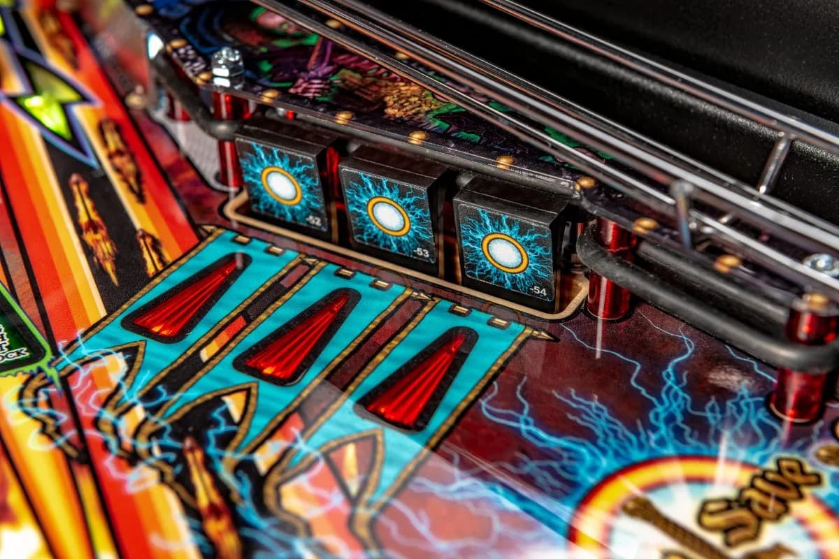 Colorful pinball machine with vibrant blue, red, and yellow game elements