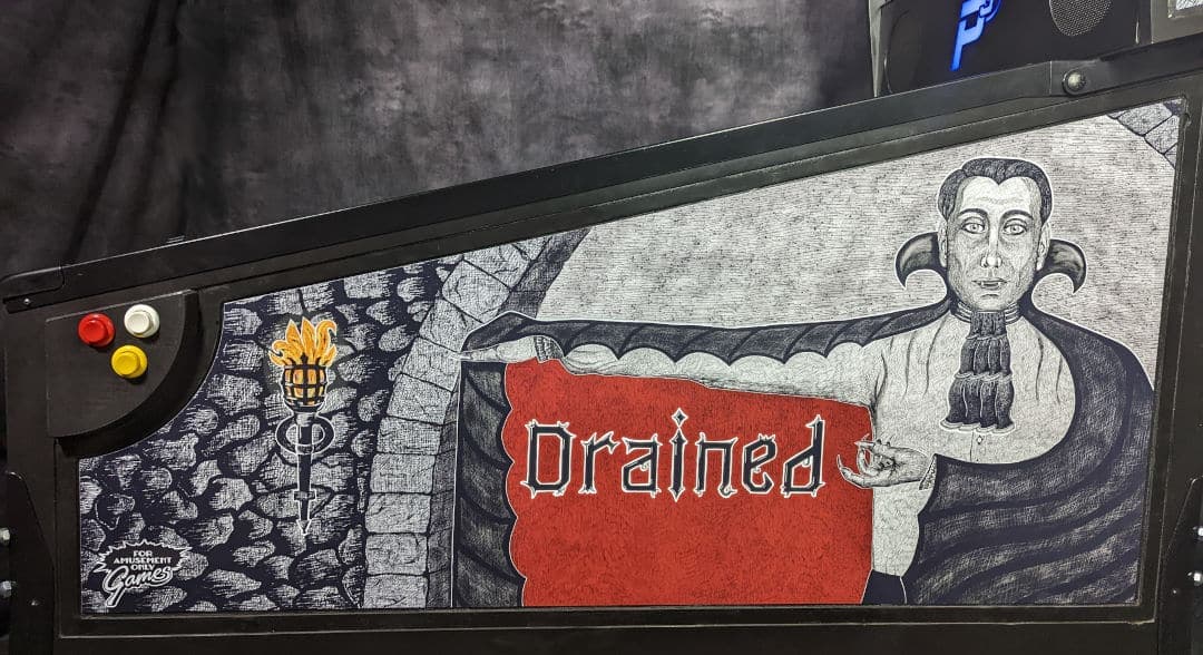 Vintage graphic design with gothic-style figure and "Drained" text