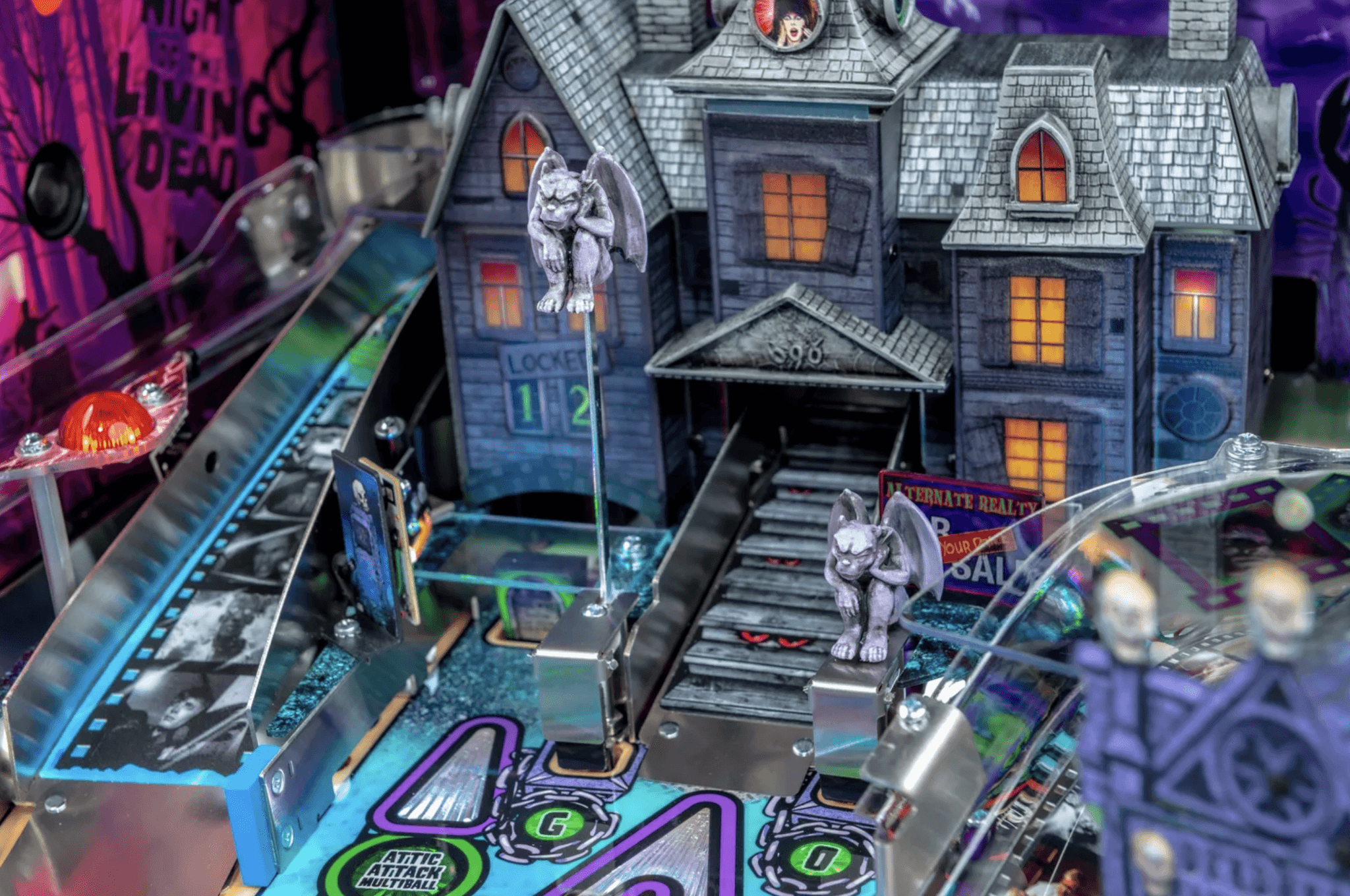 Haunted house pinball machine with gargoyles and spooky night scene