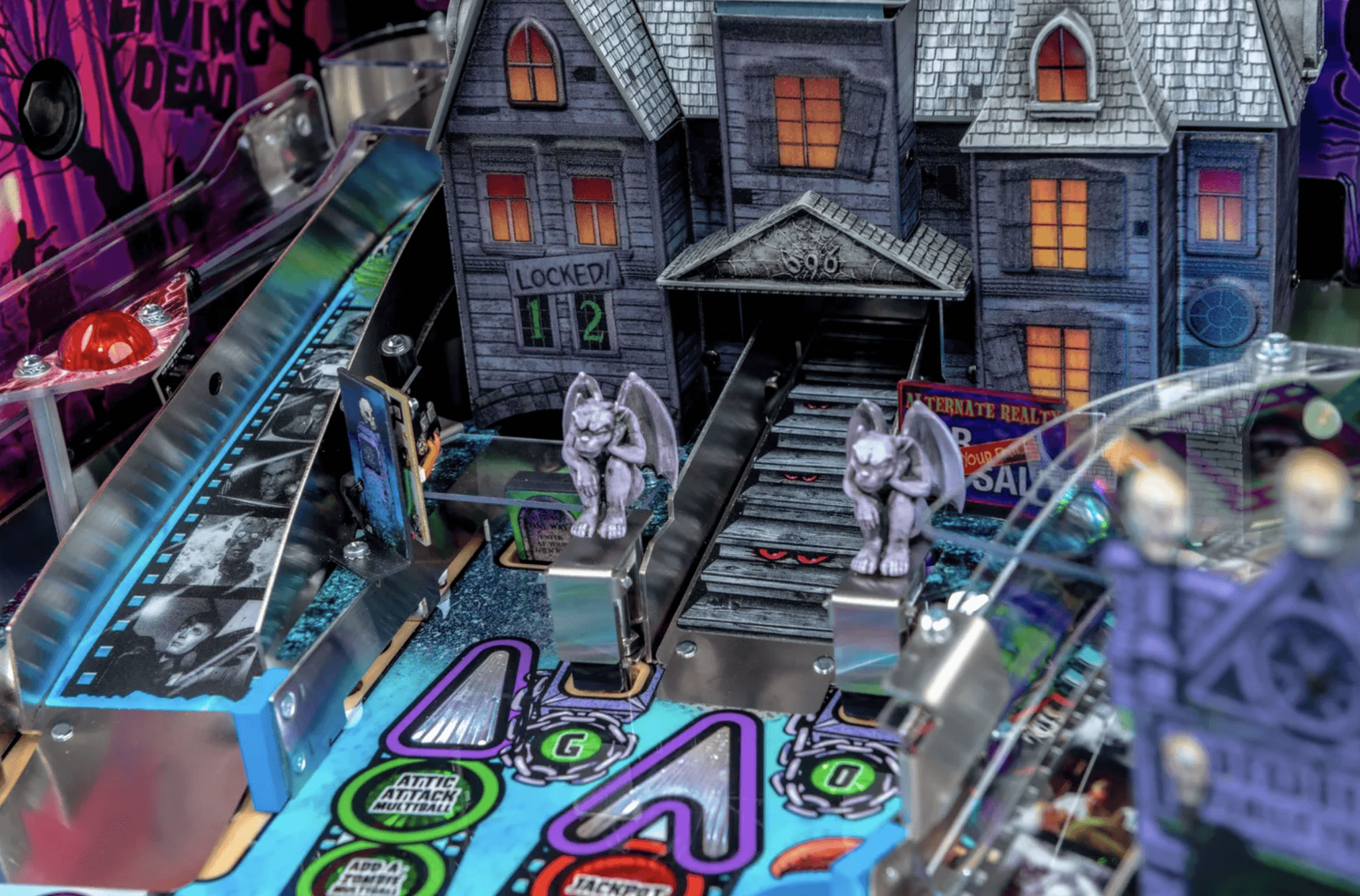 Haunted house pinball machine with gargoyles, locked rooms, and glowing windows
