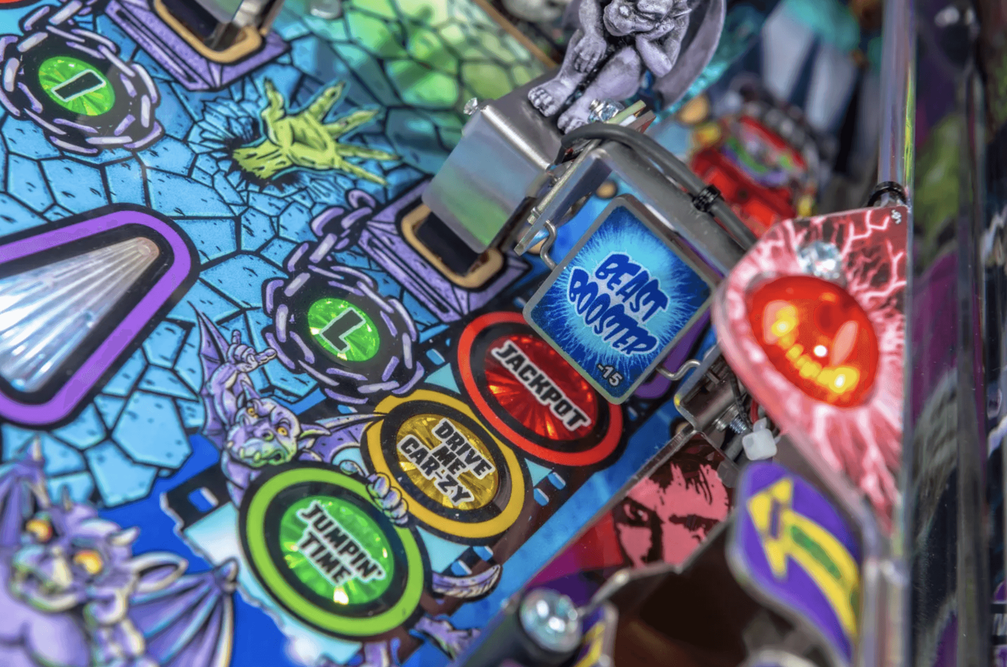 Colorful pinball machine with various game buttons and graphic design elements