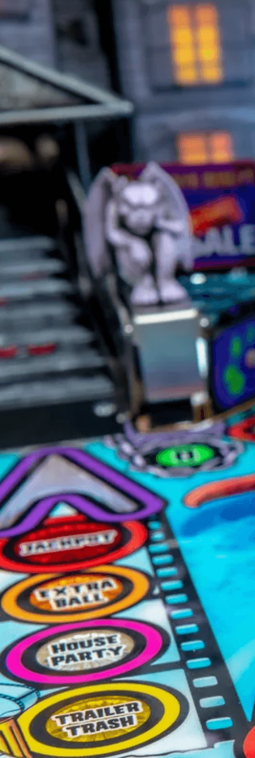 Colorful game board with movie-themed tokens and gargoyle statue