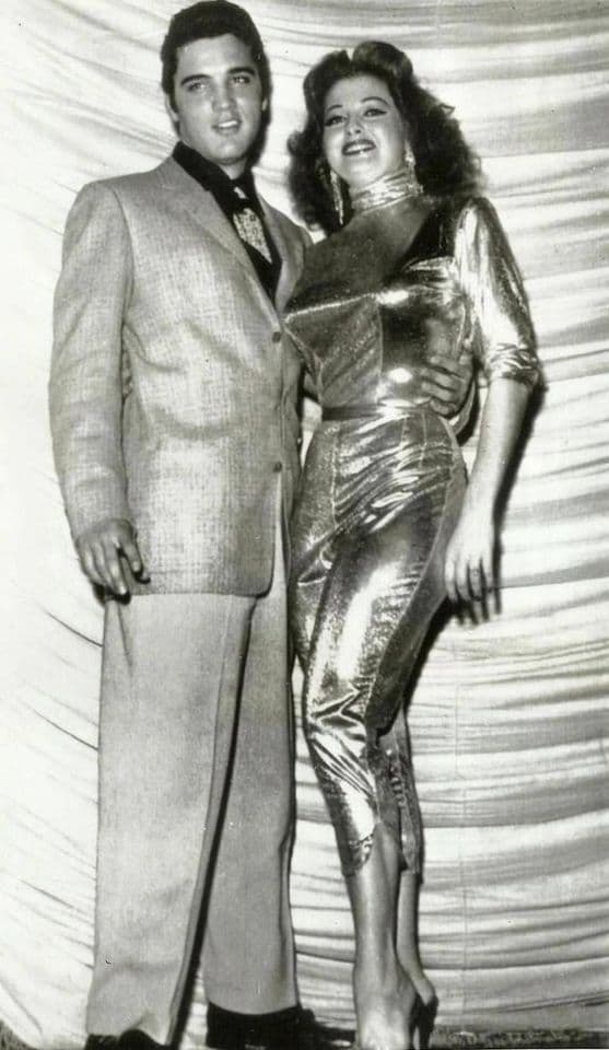 Vintage black and white photo of glamorous couple in elegant 1950s attire