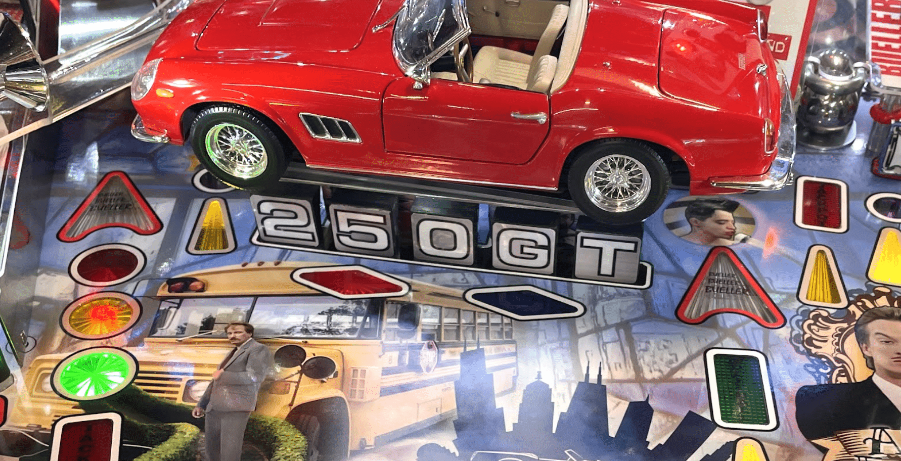 Red vintage Ferrari 250 GT model car on a detailed automotive display