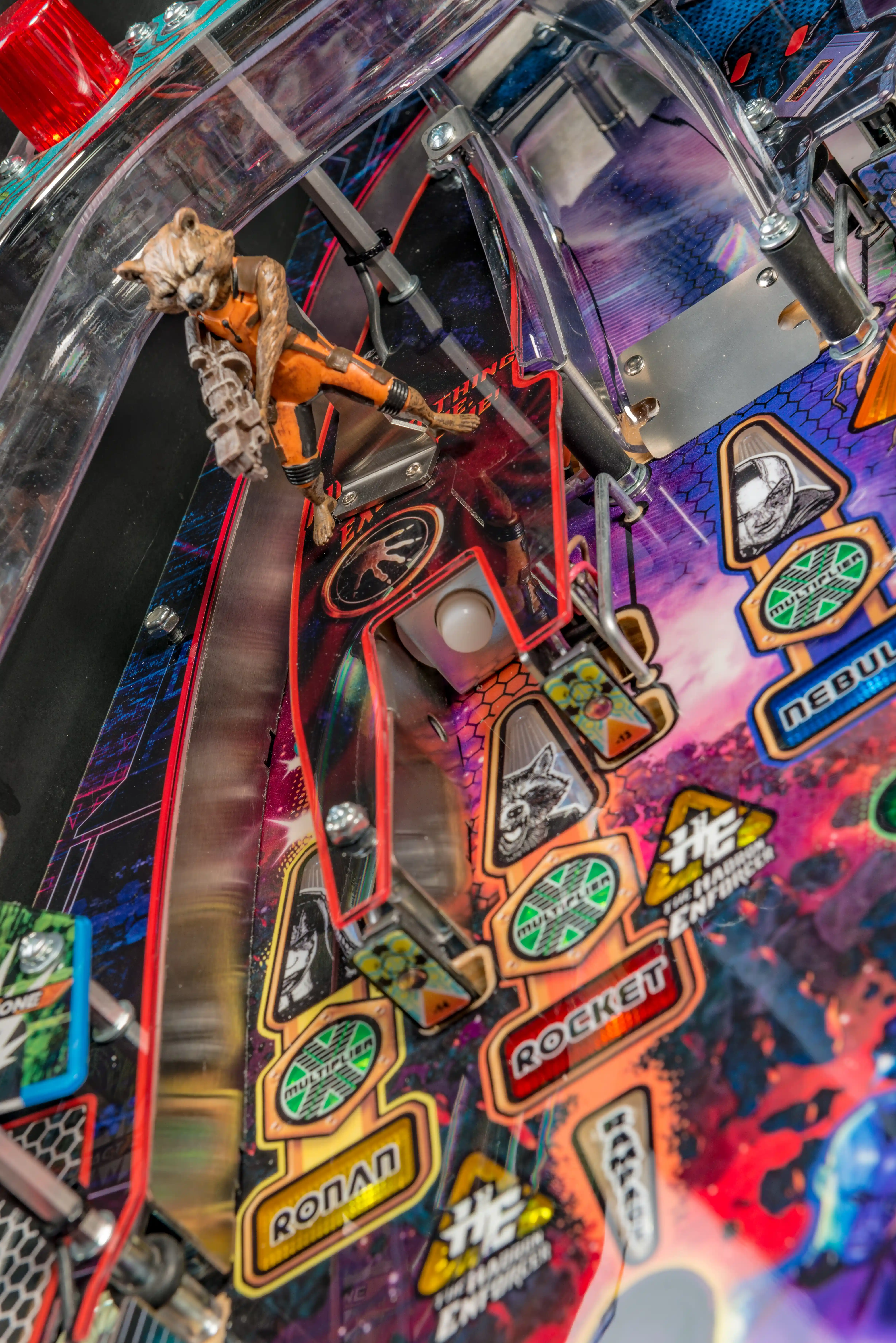 Colorful pinball machine with rocket and character details on playfield