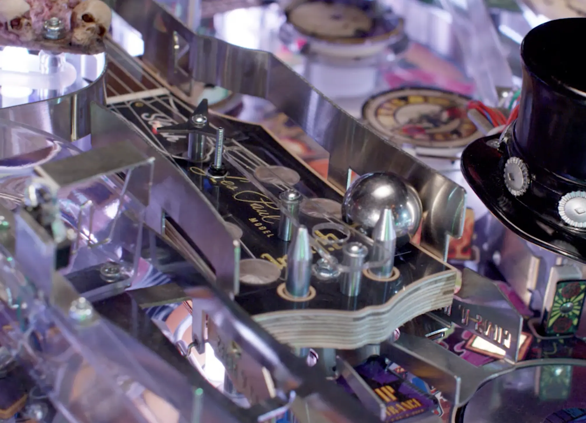 Intricate metallic pinball machine with reflective surfaces and detailed components