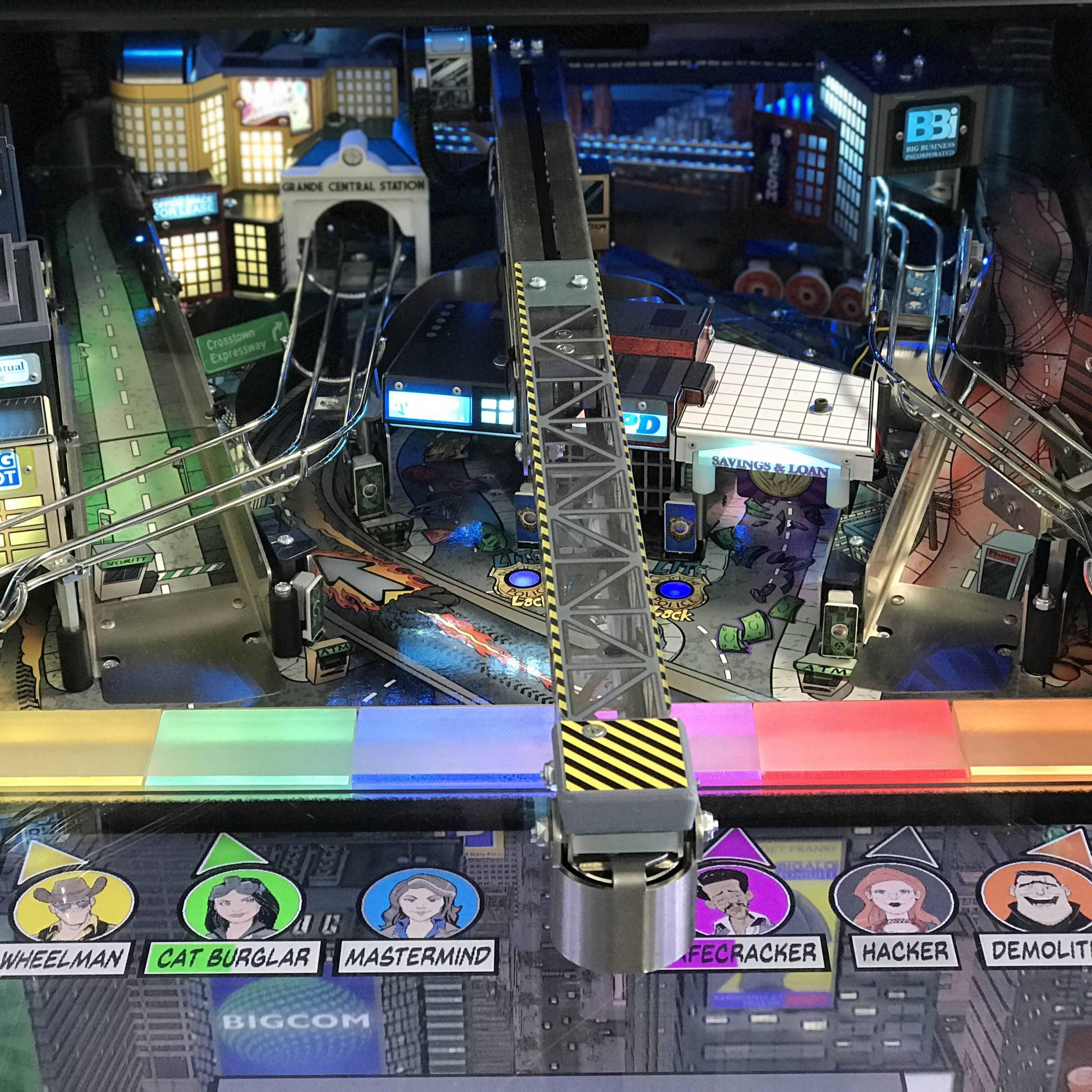 Cyberpunk-style pinball machine with city backdrop and character icons