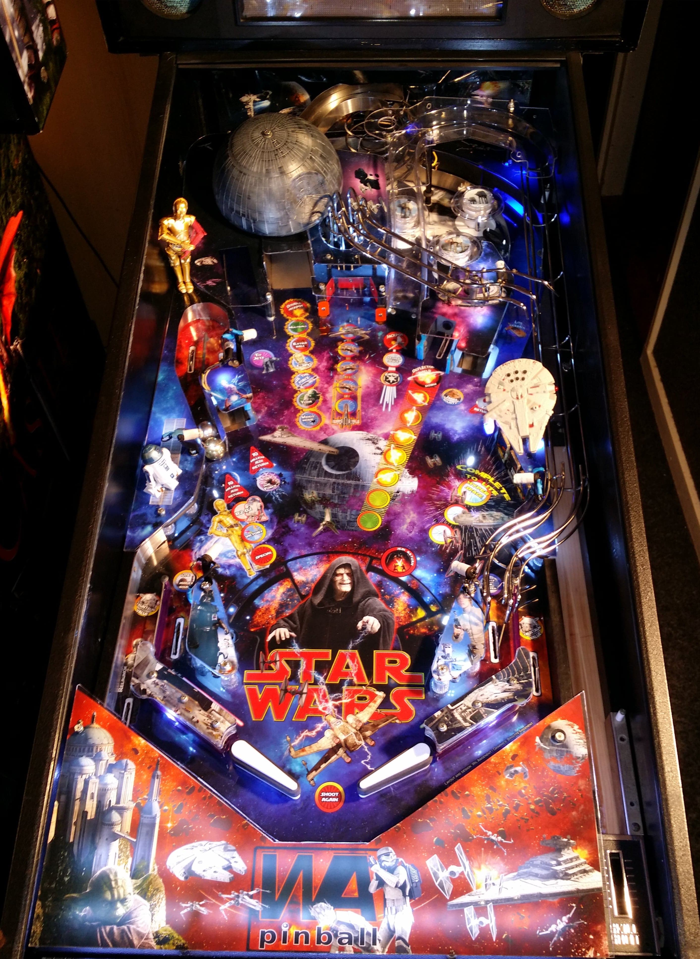 Star Wars themed pinball machine with iconic spaceships and characters