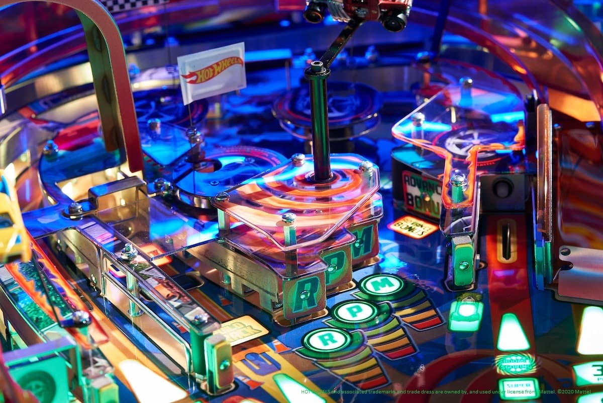 Colorful Hot Wheels pinball machine with glowing buttons and intricate design