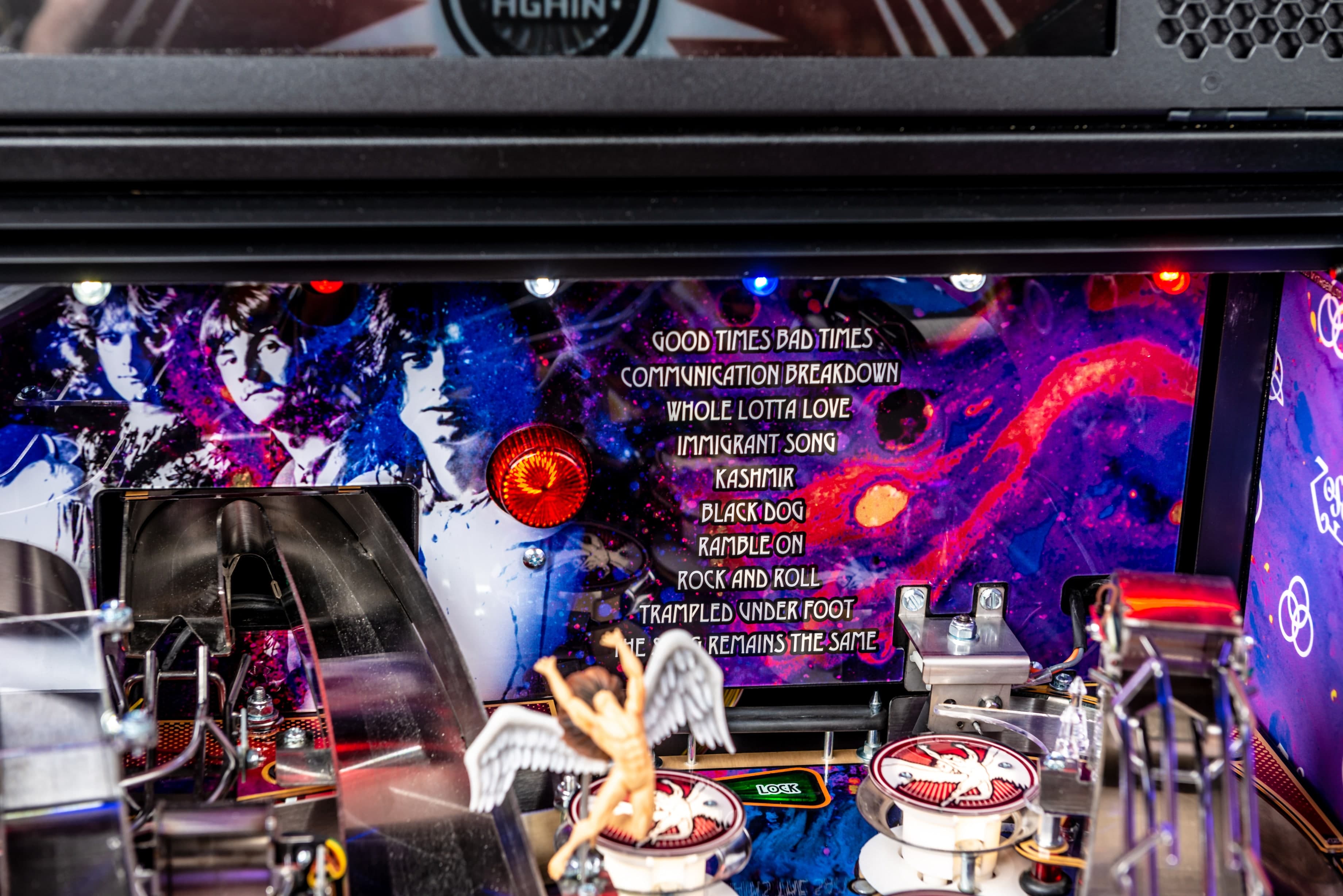 Led Zeppelin pinball machine with colorful band artwork and song titles