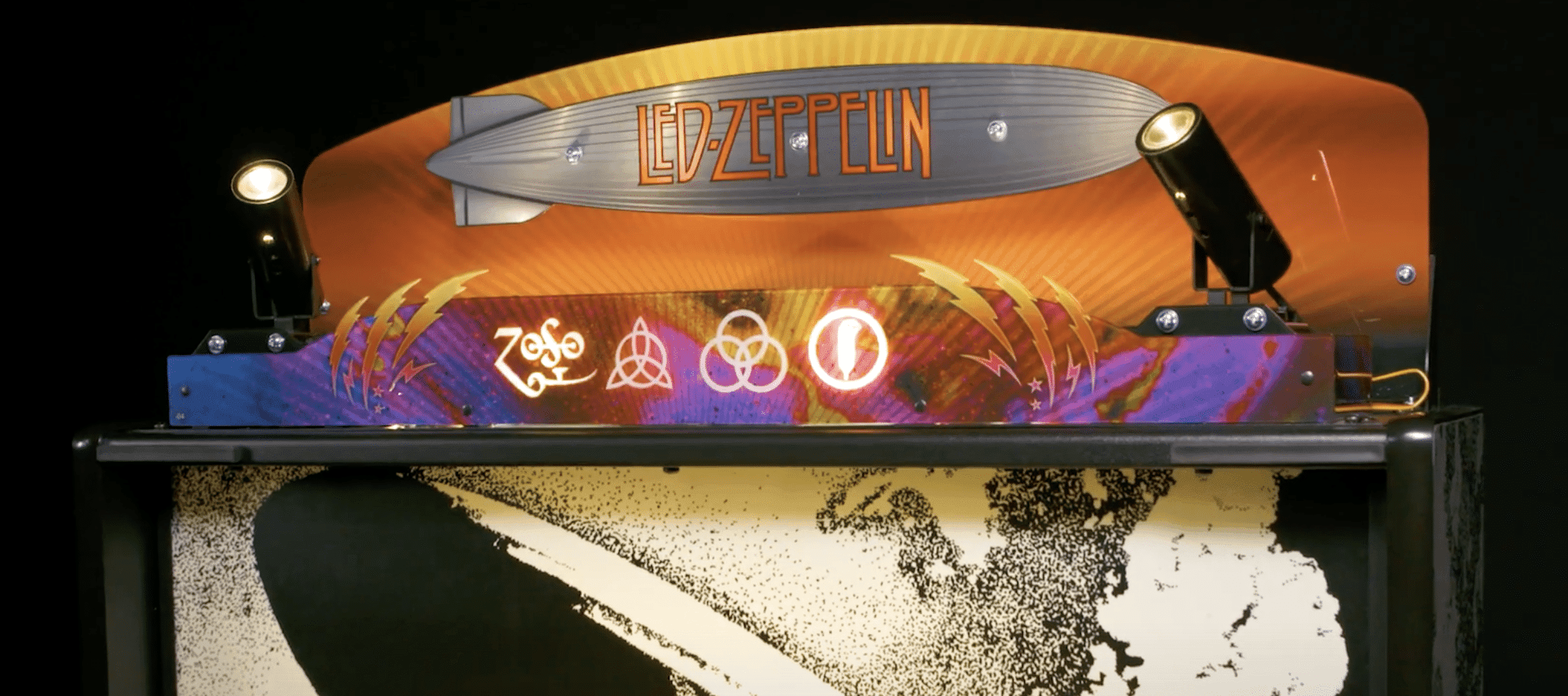 Led Zeppelin blimp with band's iconic symbols against colorful background