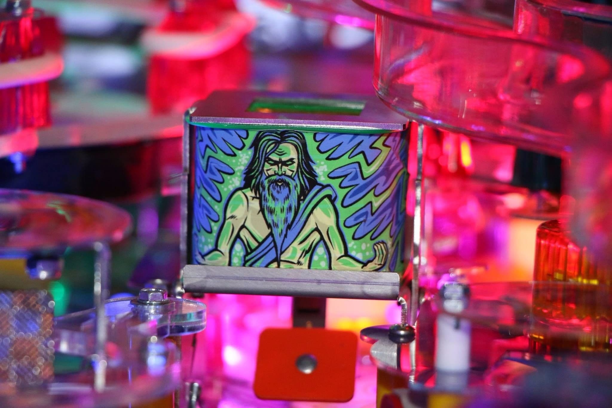 Stylized bearded figure on glass cube amidst colorful, blurry background
