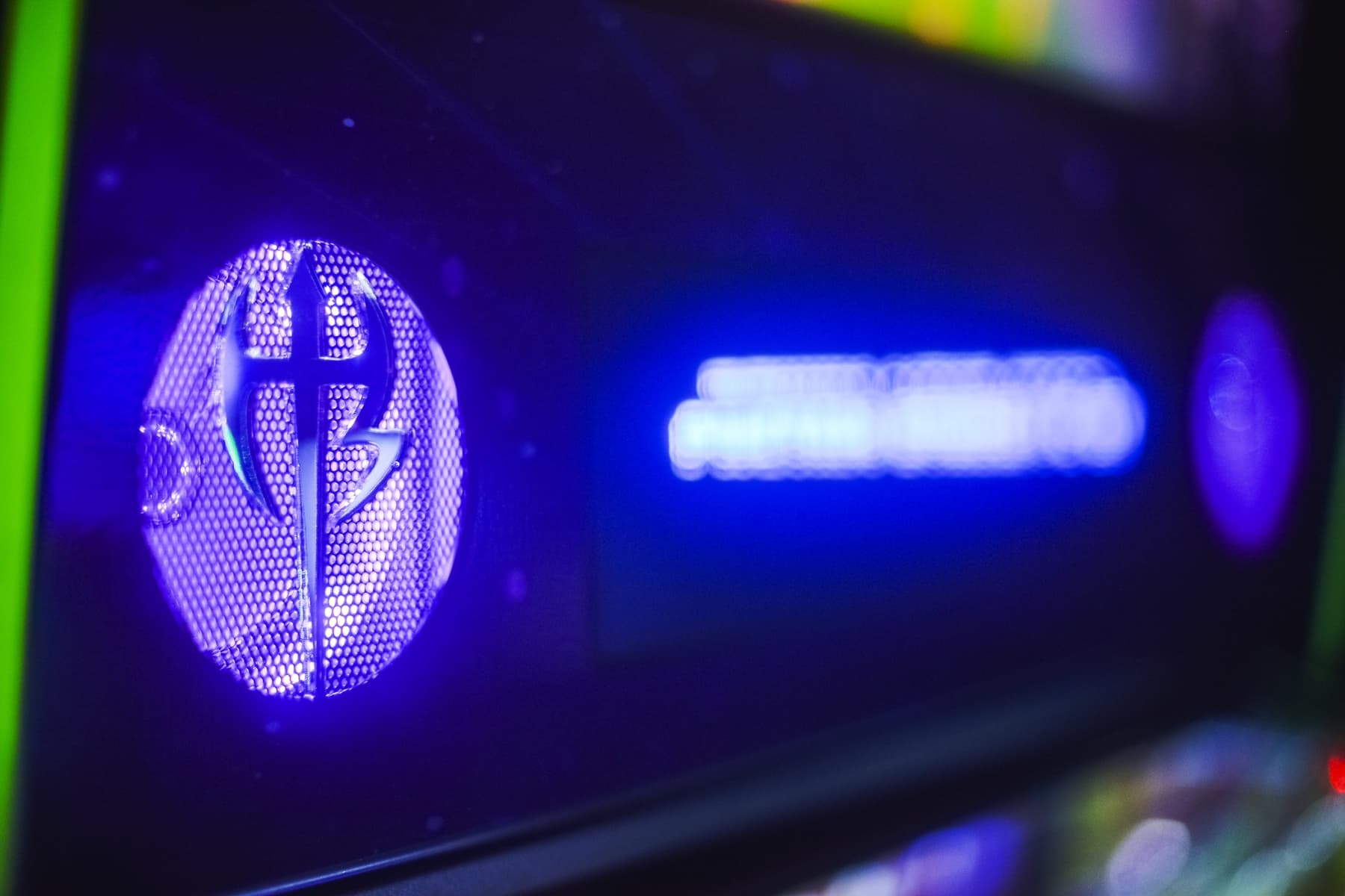 Blue glowing electronic device with mesh pattern and lightning bolt symbol