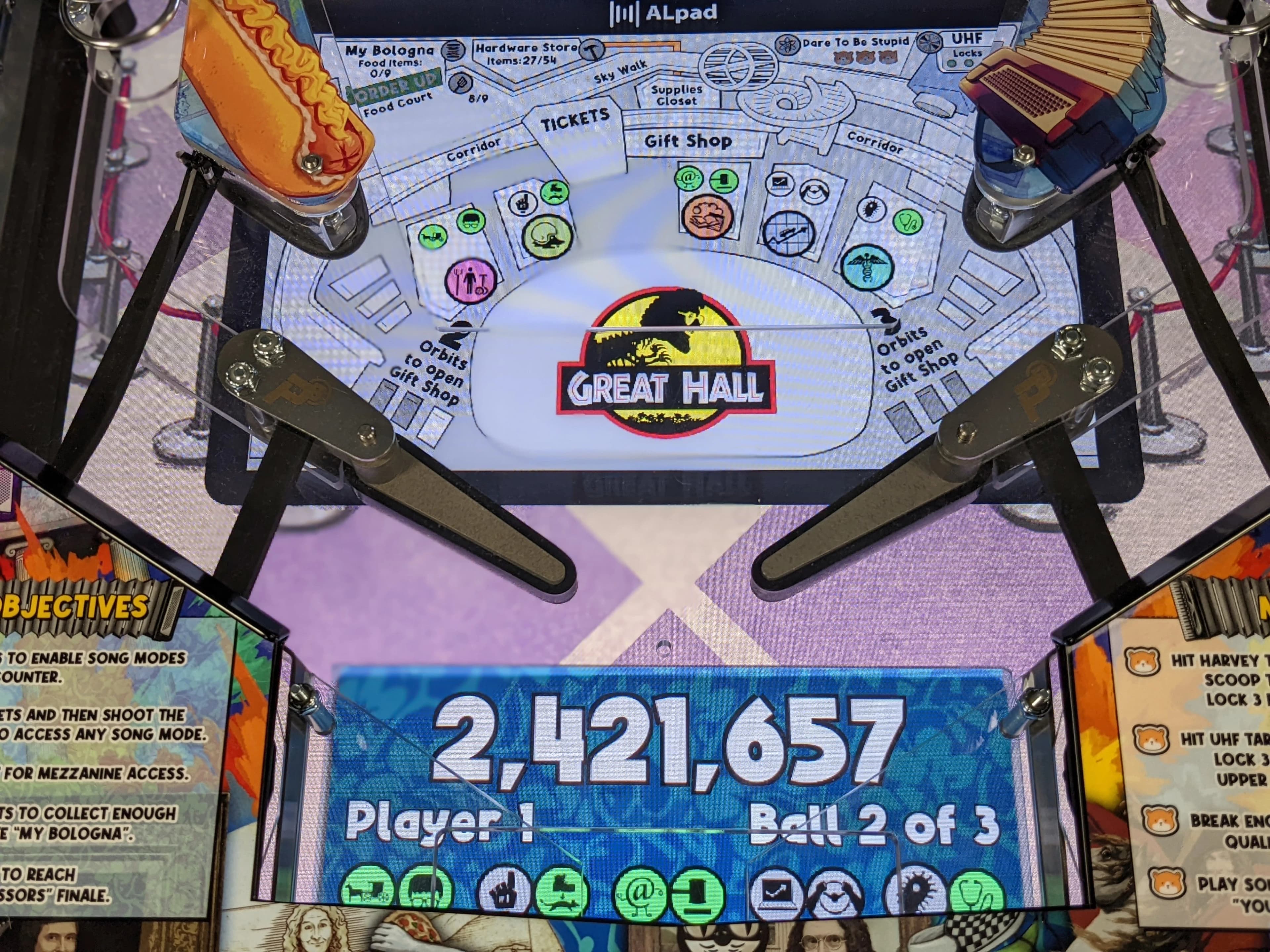 Pinball machine with Jurassic Park-themed Great Hall design and score display