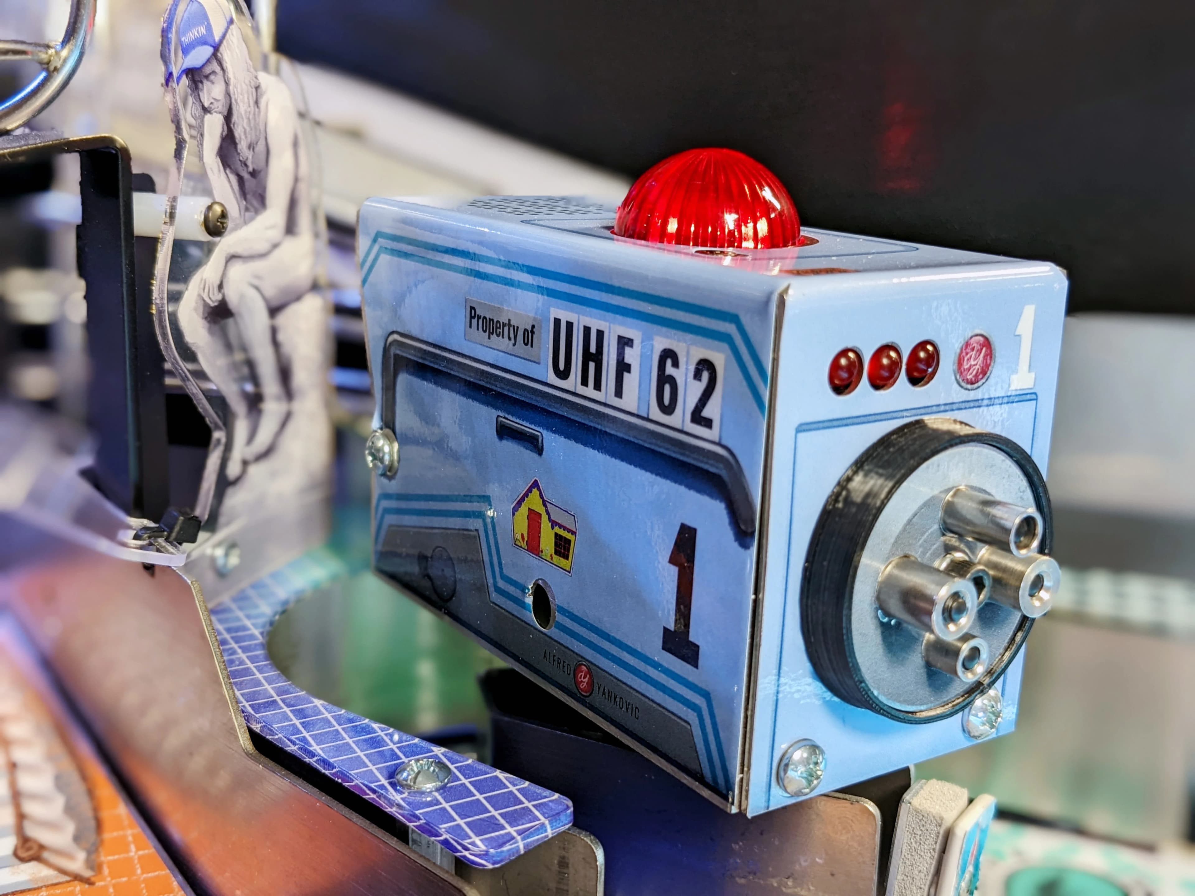 Blue vintage UHF 62 device with red signal light and mechanical components