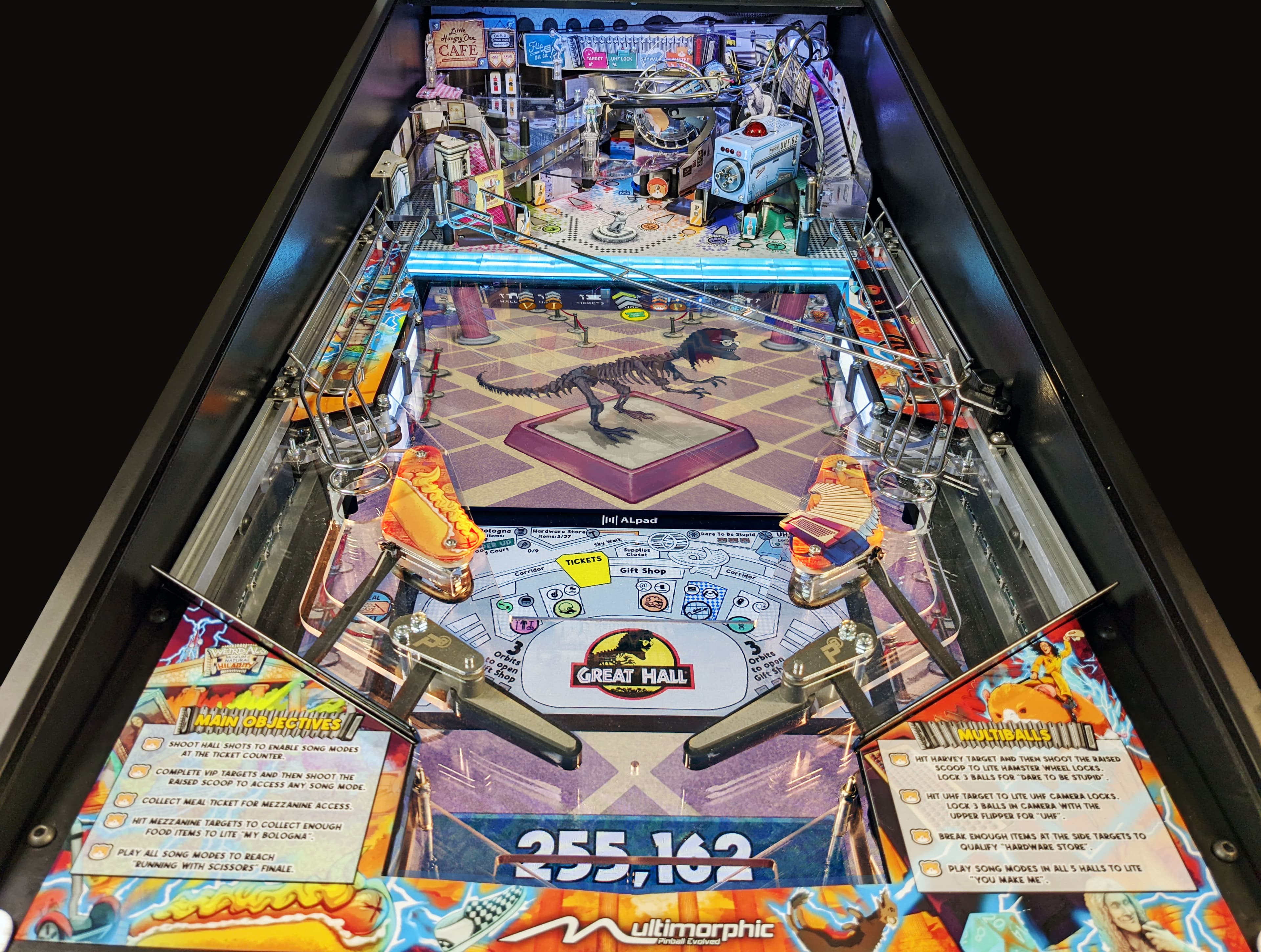 Jurassic Park-themed pinball machine with dinosaur skeleton and colorful playfield